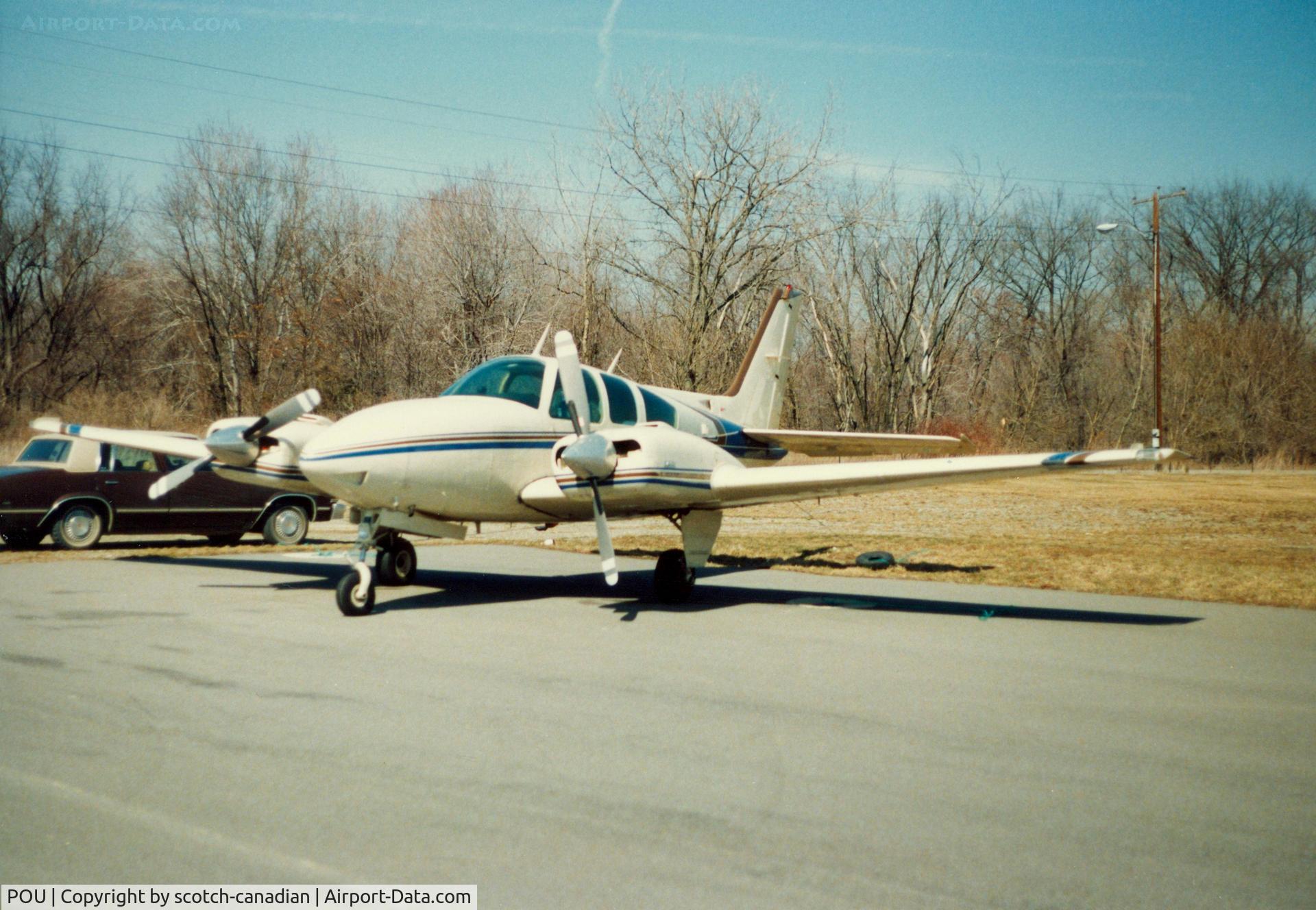 Dutchess County Airport (POU) - Beech B58 Baron parked at Dutchess County Airport, Poughkeepsie, NY - circa 1980's 