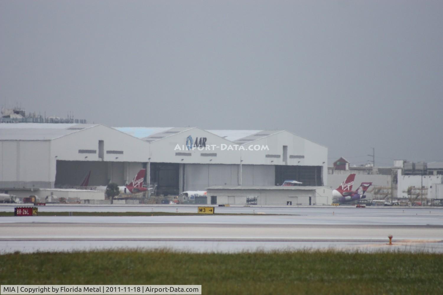 Miami International Airport (MIA) - AAR Maintenance - two Virgin America A320s, an Allegiant MD-80, a Vision 737 and even a Hawaiian 717 can be seen