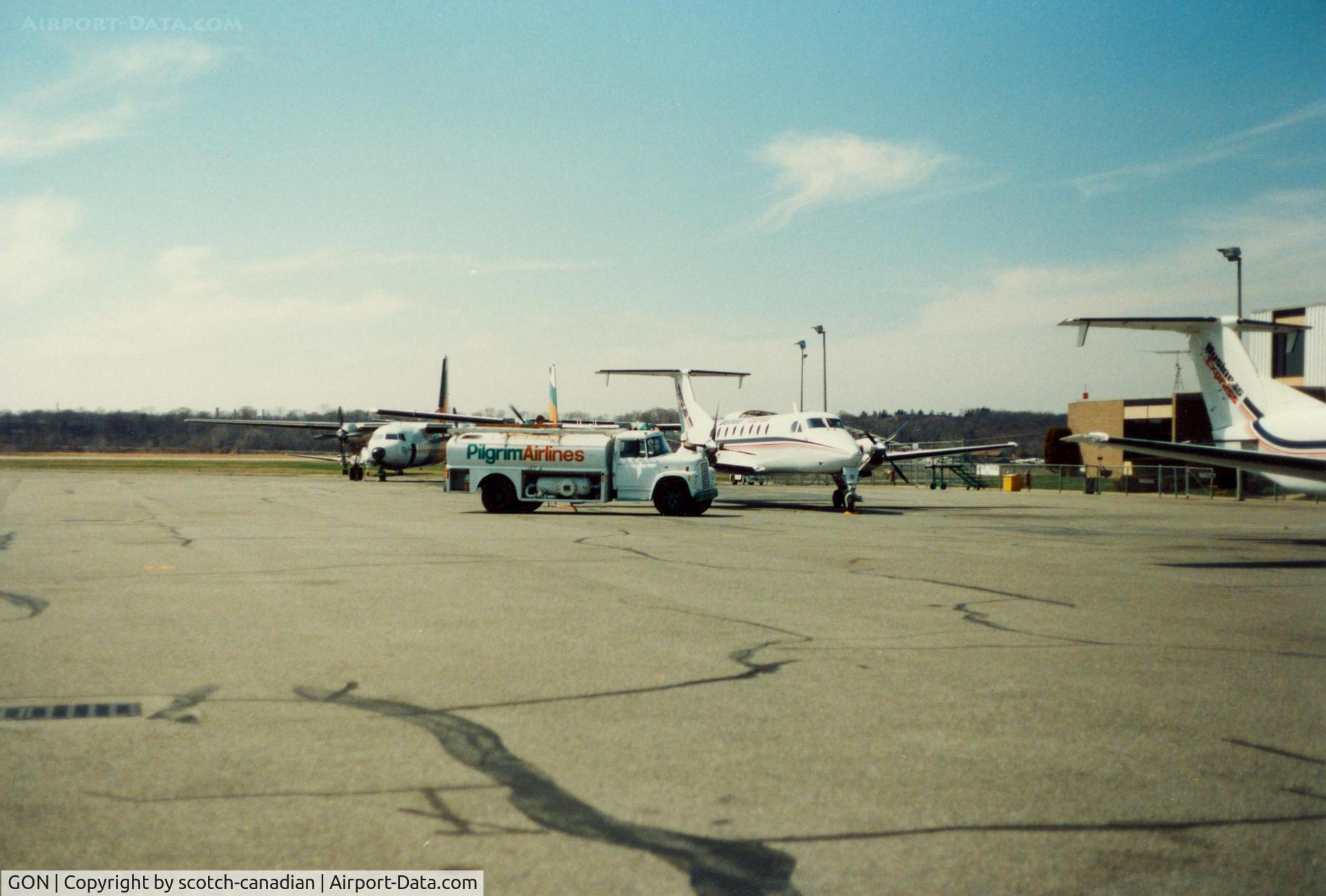 Groton-new London Airport (GON) - Pilgrim Airlines Fokker F27's, Fuel Truck and Business Express Airlines Beech 1900's at Groton-New London Airport, New London, CT - circa 1980's