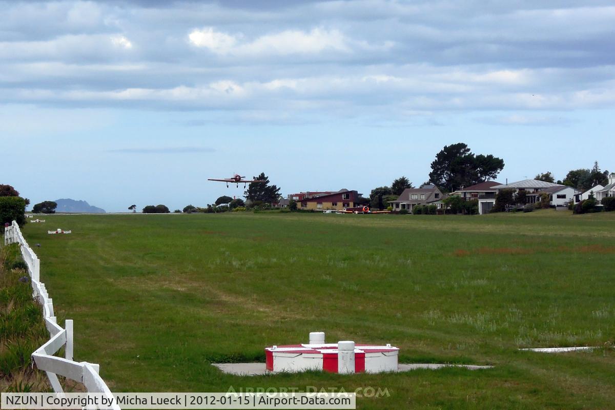 Pauanui Beach Aerodrome Airport, Pauanui New Zealand (NZUN) - YAK-52 taking off from beautiful Pauanui