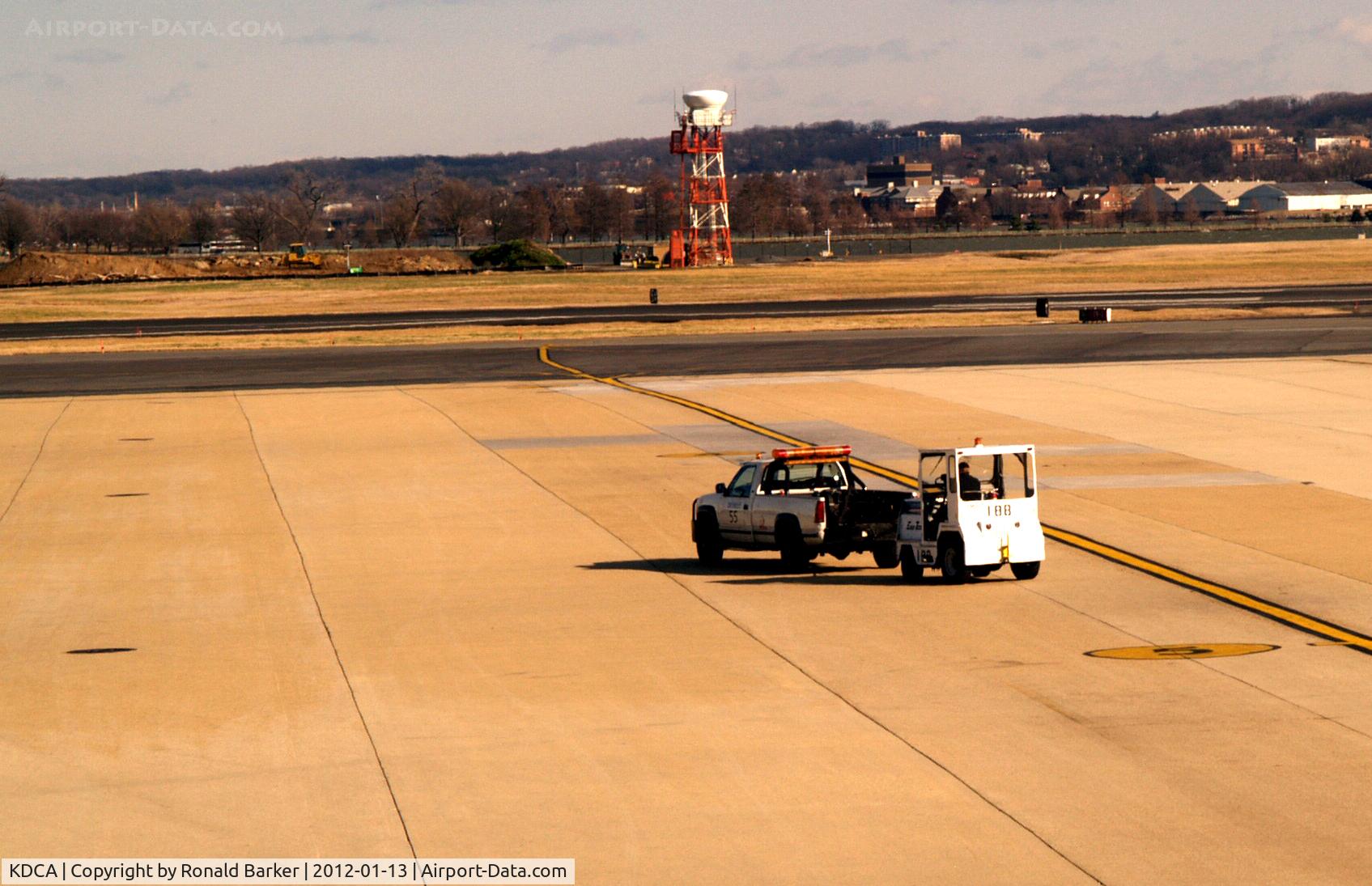 Ronald Reagan Washington National Airport (DCA) - Tug being towed by pickup truck