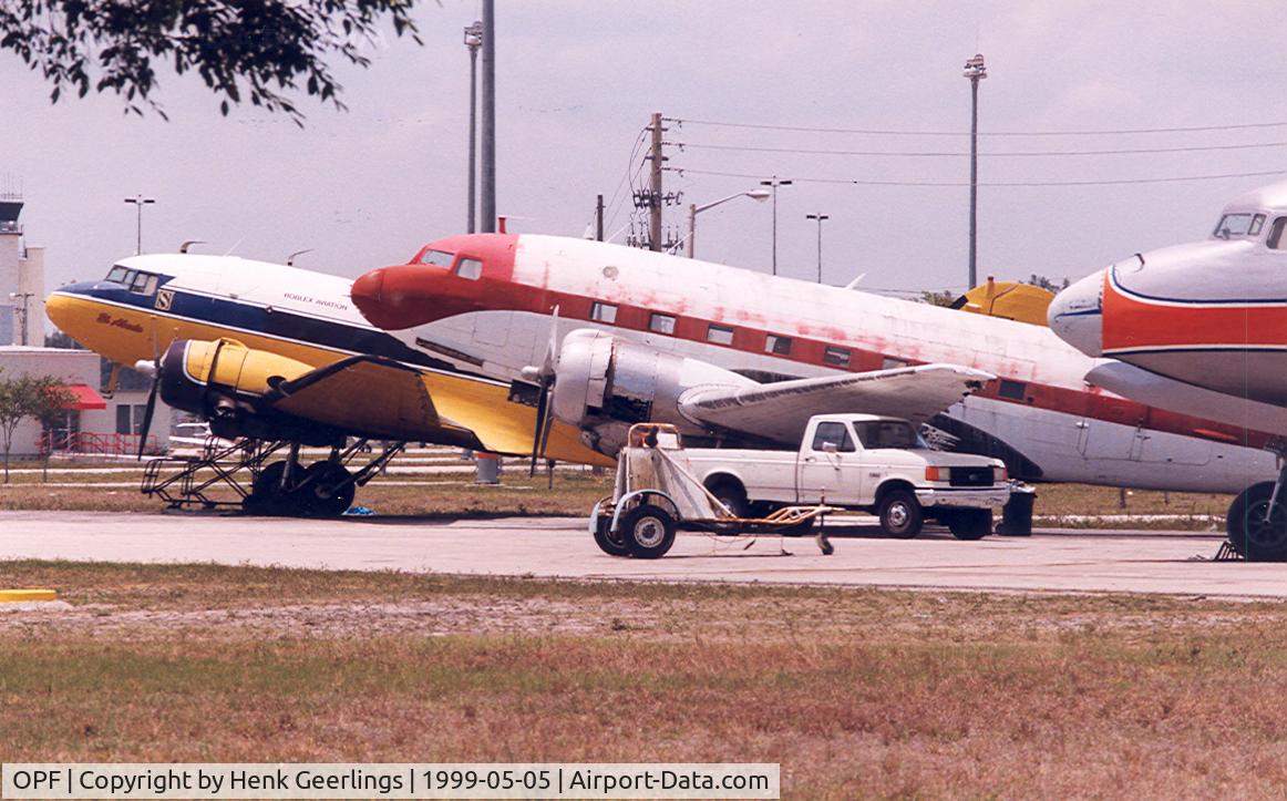 Opa-locka Executive Airport (OPF) - Yellow plane is N50E , cn 11657  DC-3A

Red plane is  N212DD , cn 43389  C-117D

Nose  N381AA , DC-7BF  cn 44921
