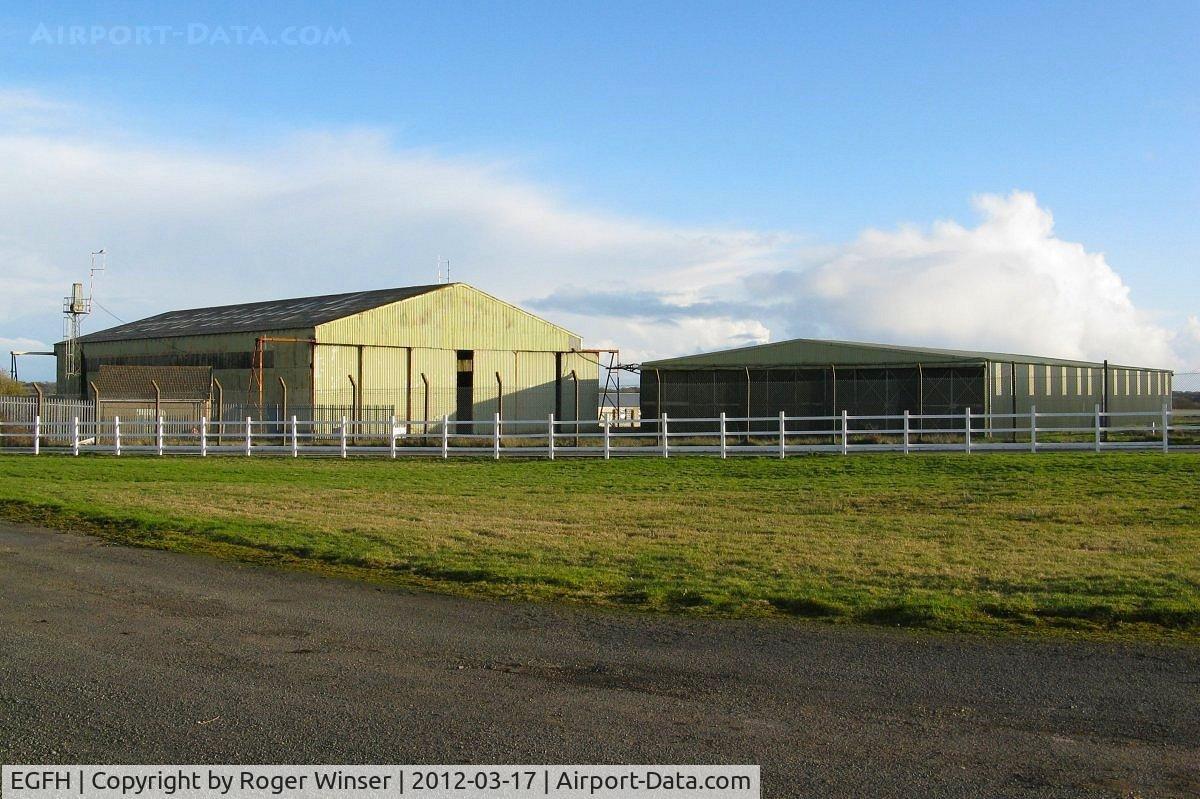 Swansea Airport, Swansea, Wales United Kingdom (EGFH) - T2 hybrid type? (Hangar 1) and Bellman (Hangar 2) hangars at Swansea Airport.
