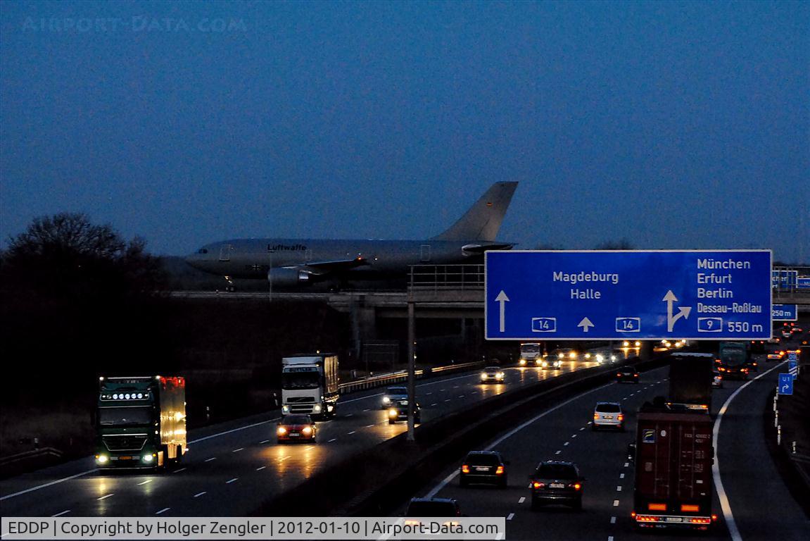 Leipzig/Halle Airport, Leipzig/Halle Germany (EDDP) - Military traffic on taxiway west and normal morning traffic on A 14 thereunder.....