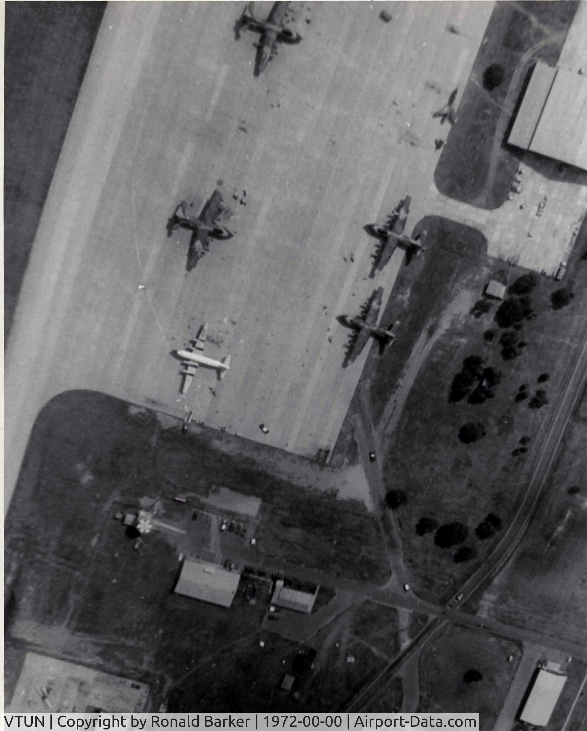 Khorat Air Force Base Airport, Nakhon Ratchasima (Khorat) Thailand (VTUN) - Overhead pattern summer 1972.  Note the F-105 that is in two pieces in the upper right corner.