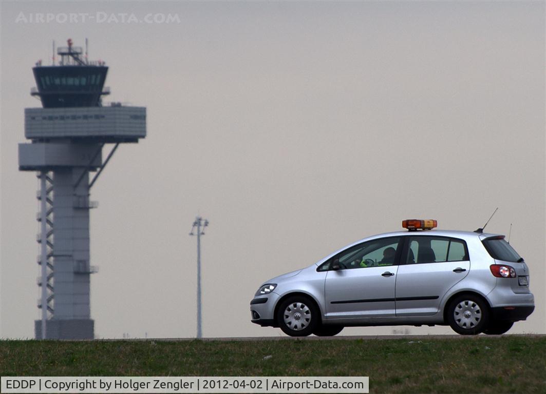 Leipzig/Halle Airport, Leipzig/Halle Germany (EDDP) - I guessed he was watching me, but now it seems to me the mouse policeman is listening to his masters voice....