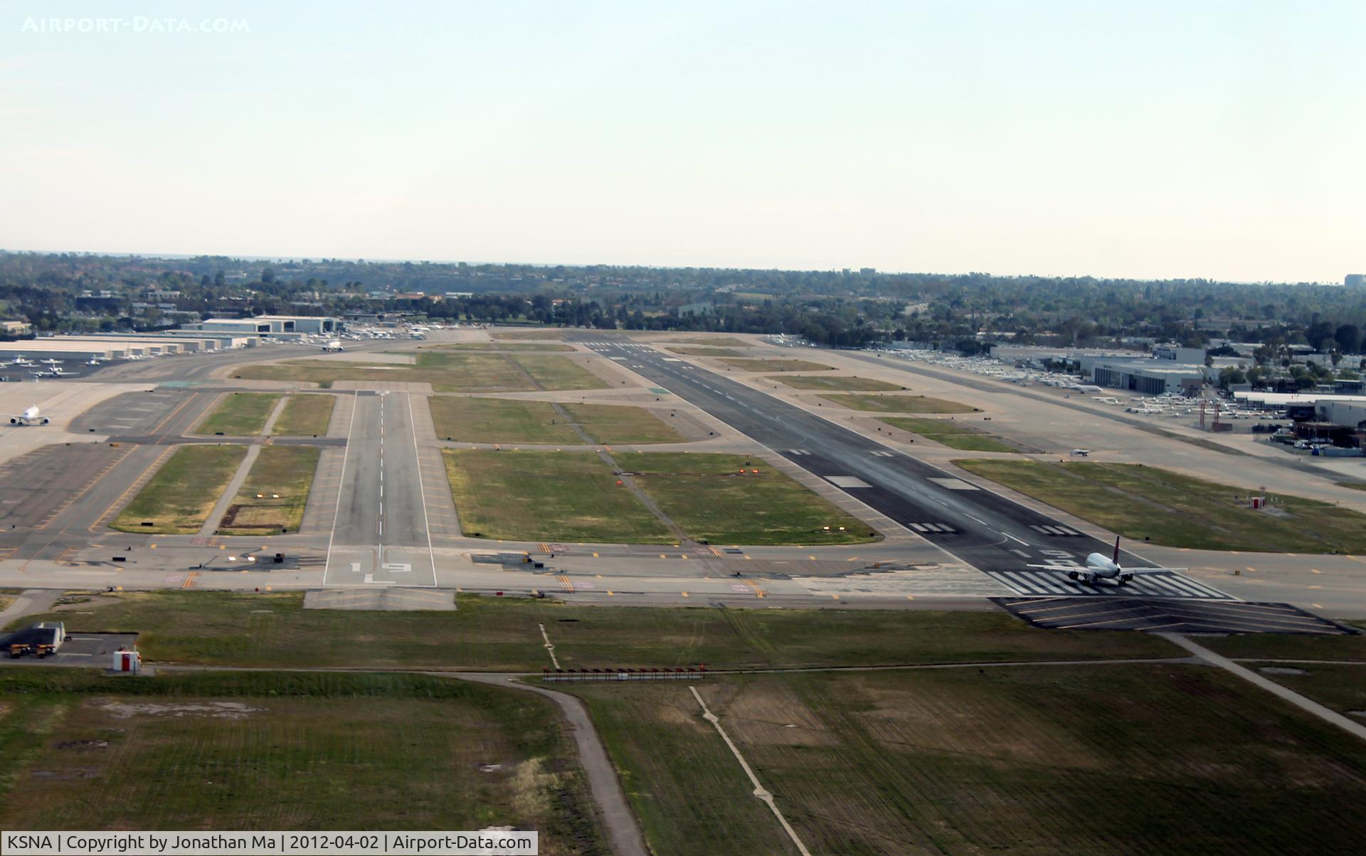 John Wayne Airport-orange County Airport (SNA) - On approach, and eventually a hard touch and go. Delta A319 lining up on 19R