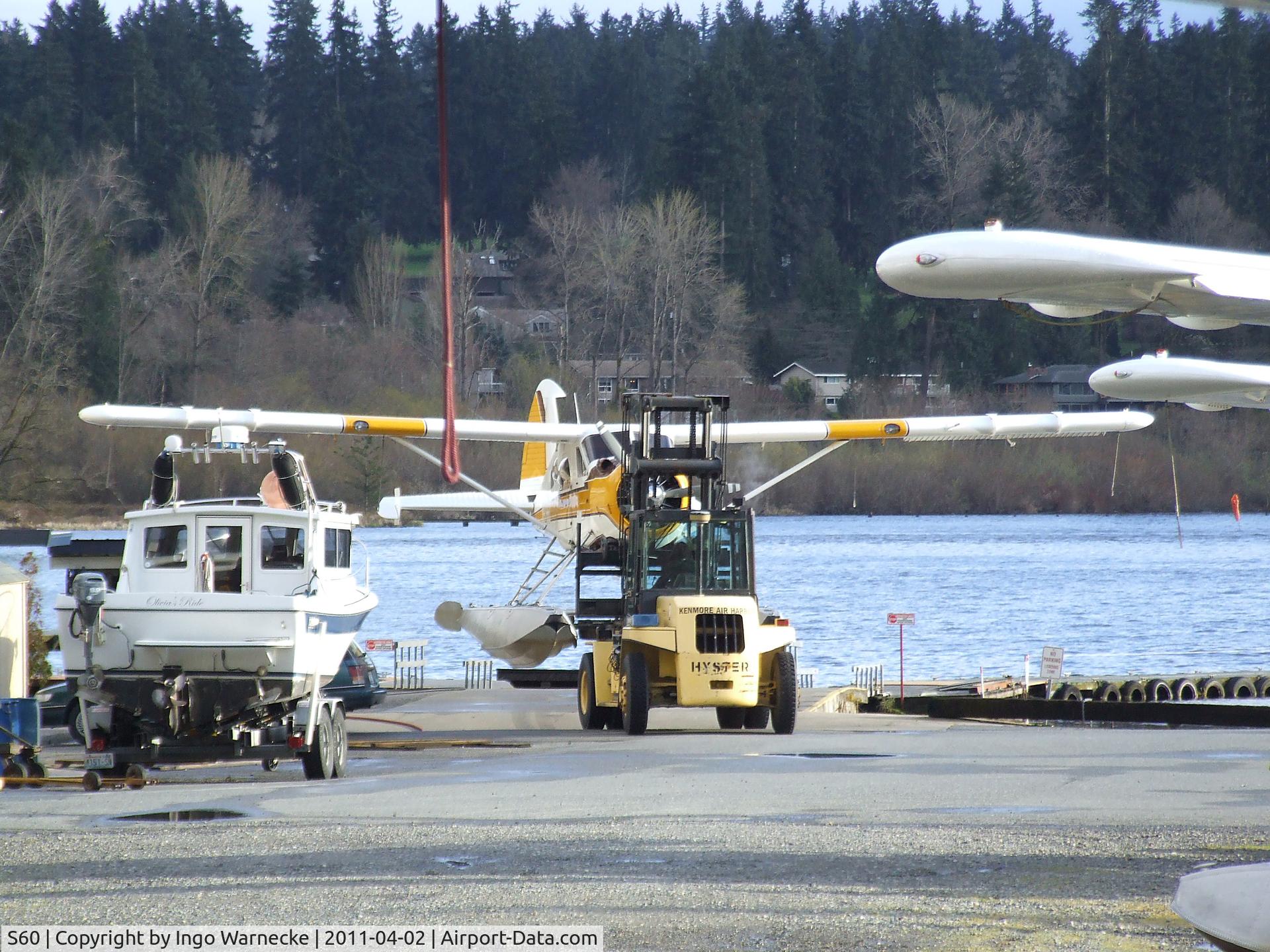 Kenmore Air Harbor Inc Seaplane Base (S60) - a Beaver is being beached and 
