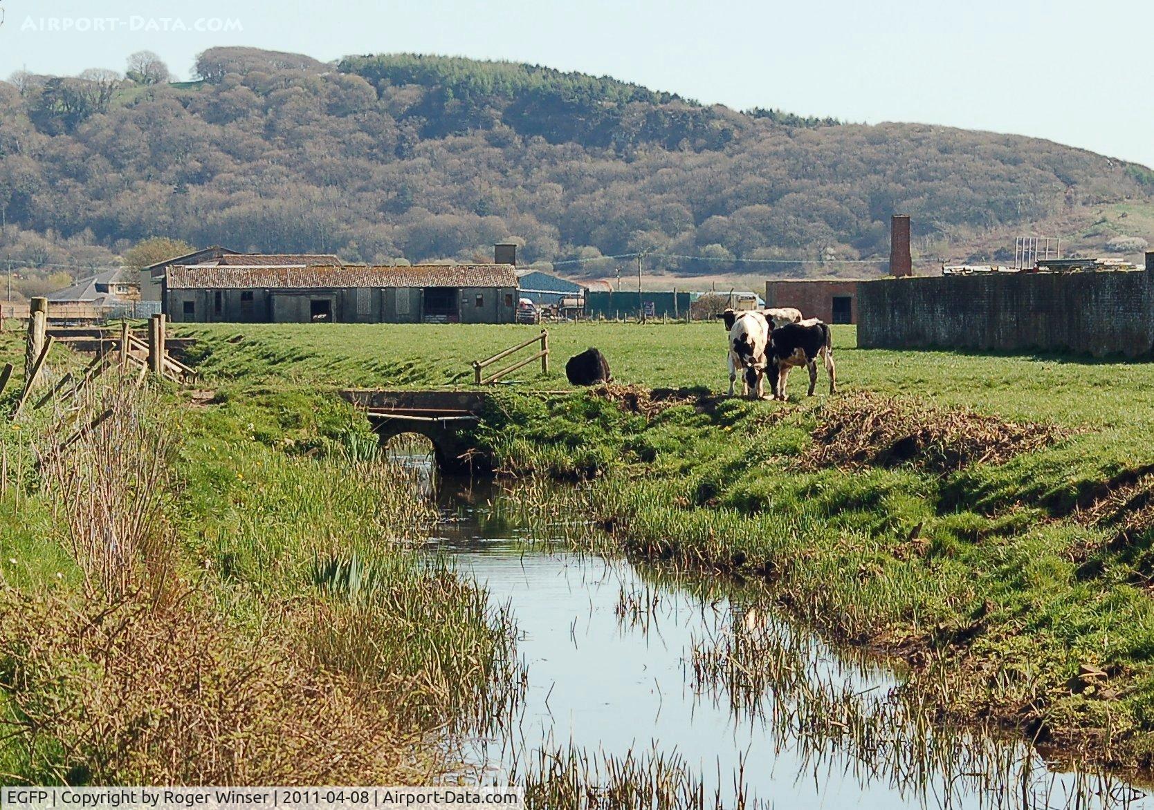 Pembrey Airport, Pembrey, Wales United Kingdom (EGFP) - Out of use barracks on the former RAF Station Pembrey technical site. The stream runs through the former technical site and under Pembrey Airport's runway.