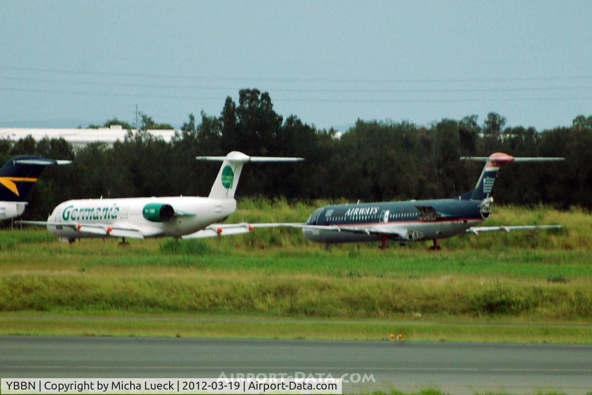 Brisbane International Airport, Brisbane, Queensland Australia (YBBN) - A couple of unexpected tails in Australia: F100s of Germania (Germany) and US Airways (USA) - used for parts by Alliance