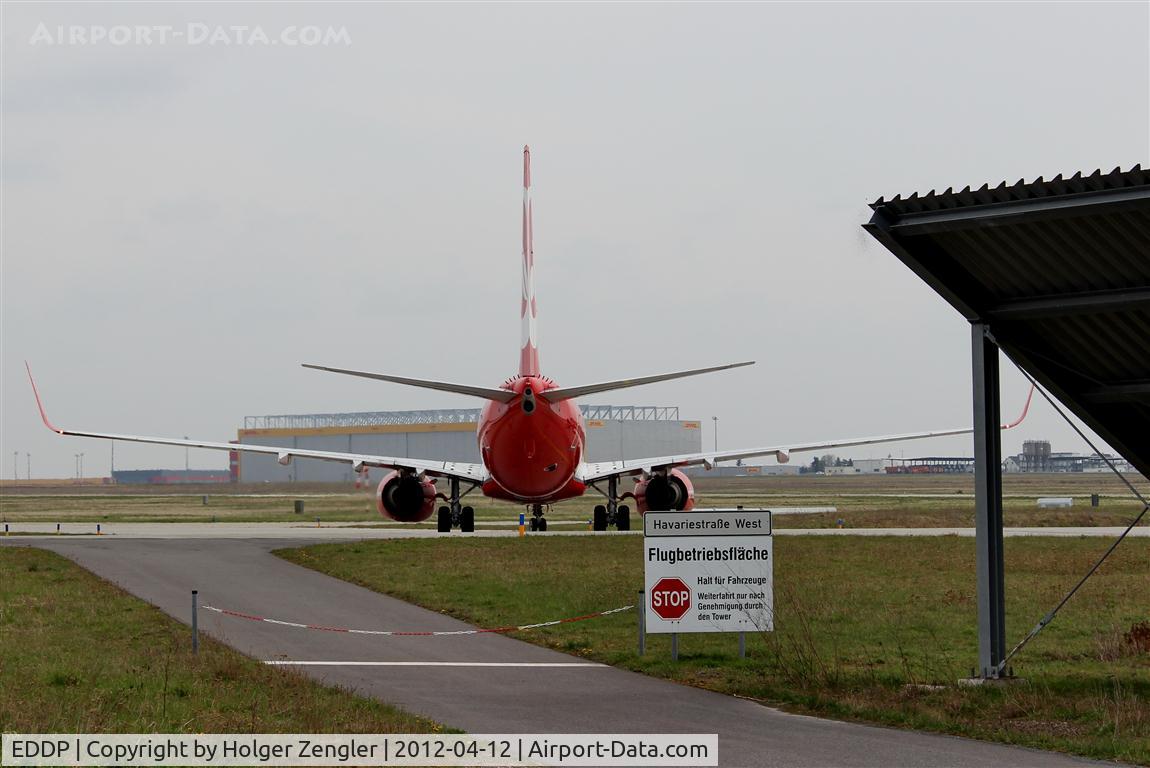 Leipzig/Halle Airport, Leipzig/Halle Germany (EDDP) - After taxiing along W1 aircrafts have to turn left at this point to continue taxi to apron 1 and gates...