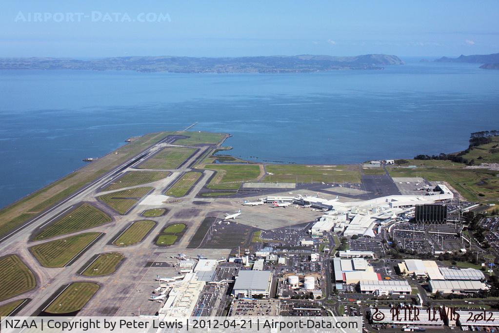 Auckland International Airport, Auckland New Zealand (NZAA) - Threshold RW05 from 1400ft in the overhead, Manukau Harbour and Awhitu Peninsular in the background.