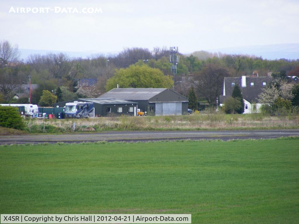 X4SR Airport - hangar on the private strip that uses part of the NE taxi way as a runway
