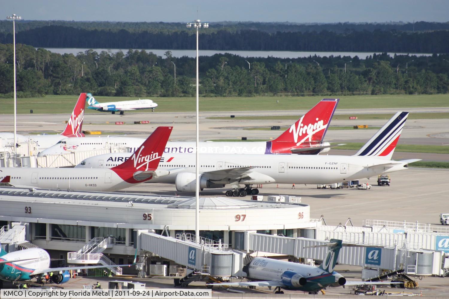 Orlando International Airport (MCO) - Busy Saturday at MCO - all international gates occupied - Gate 81 - Virgin A330, 83 - Air France 777, 85 -Virgin 747, 87 - Virgin 747 84 (not pictured) Lufthansa A340-600, 82 (not pictured) Virgin A330, 80 (not pictured) British 777