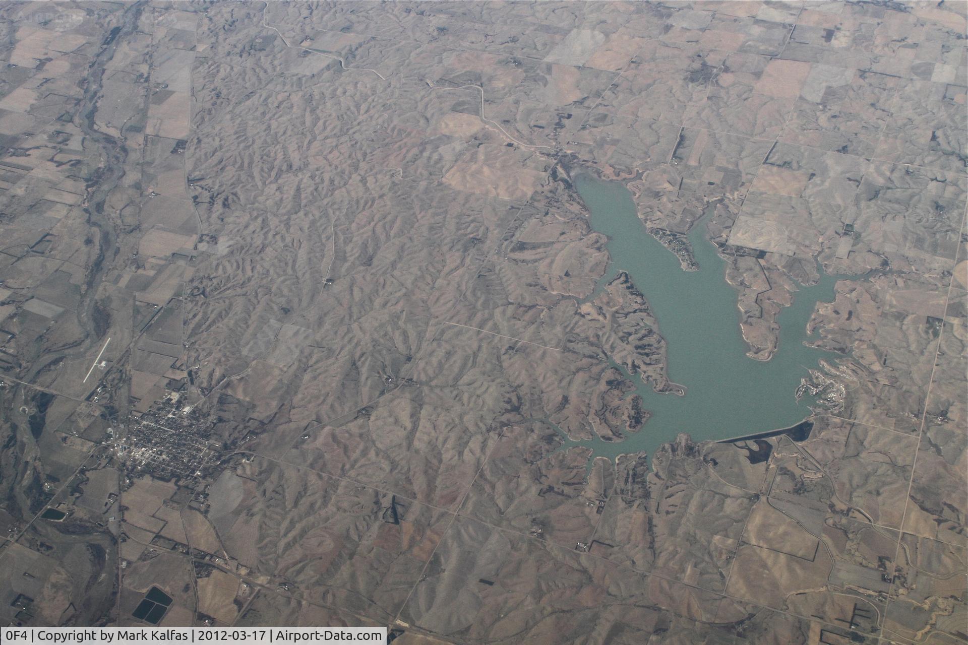 Loup City Municipal Airport (0F4) - Loup City, Nebraska - Loup City Municipal Airport as seen on a 065 heading at 37,000' en route from Phoenix to Chicago. The Sherman Reservoir is located on the right side of the frame.