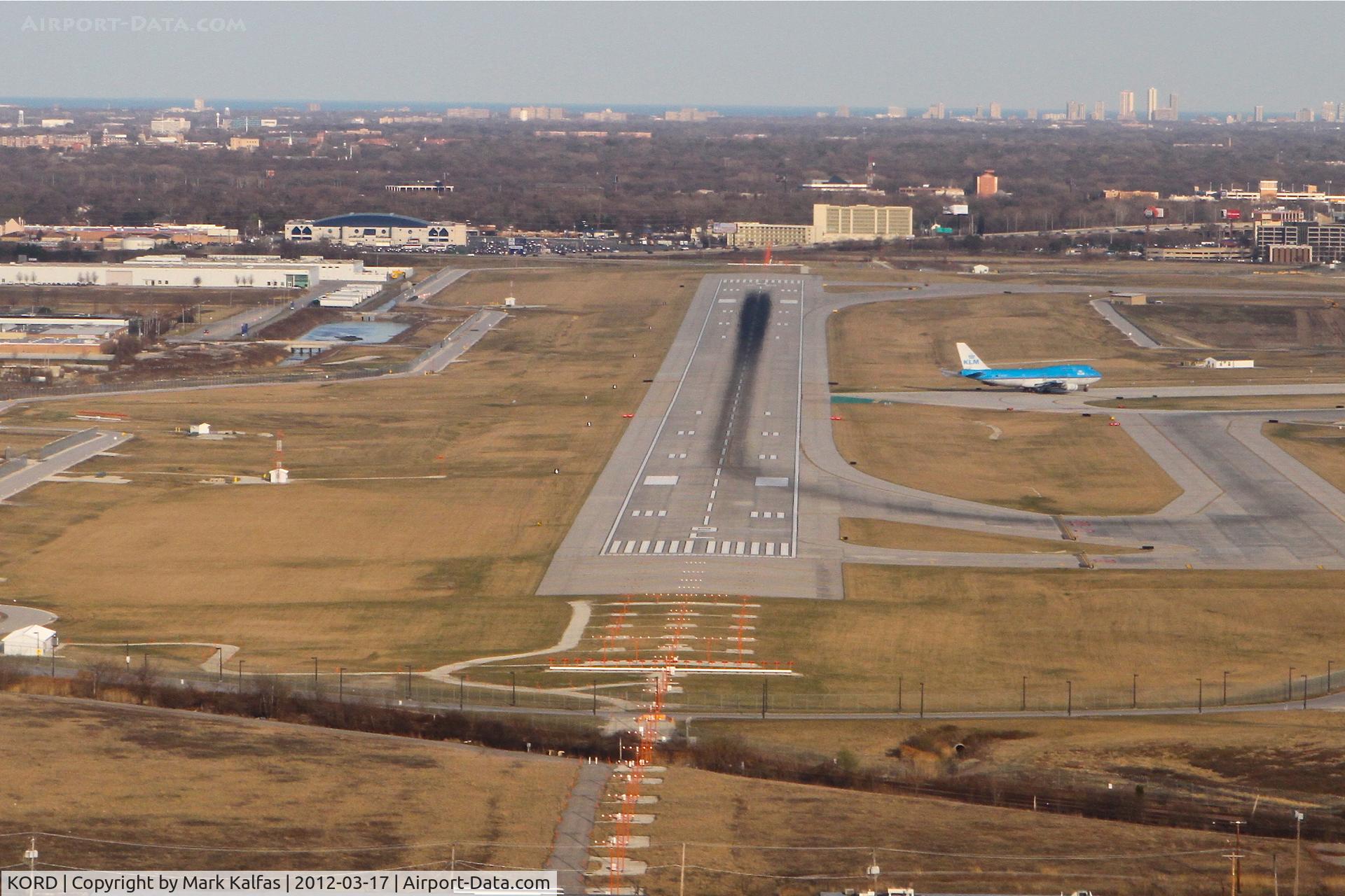 Chicago O'hare International Airport (ORD) - Chicago, Illinois -O'Hare International Airport,  RWY 9L as seen on short final for RWY 14R KORD. KLM 744 is in position on the parallel 14L waiting to depart.