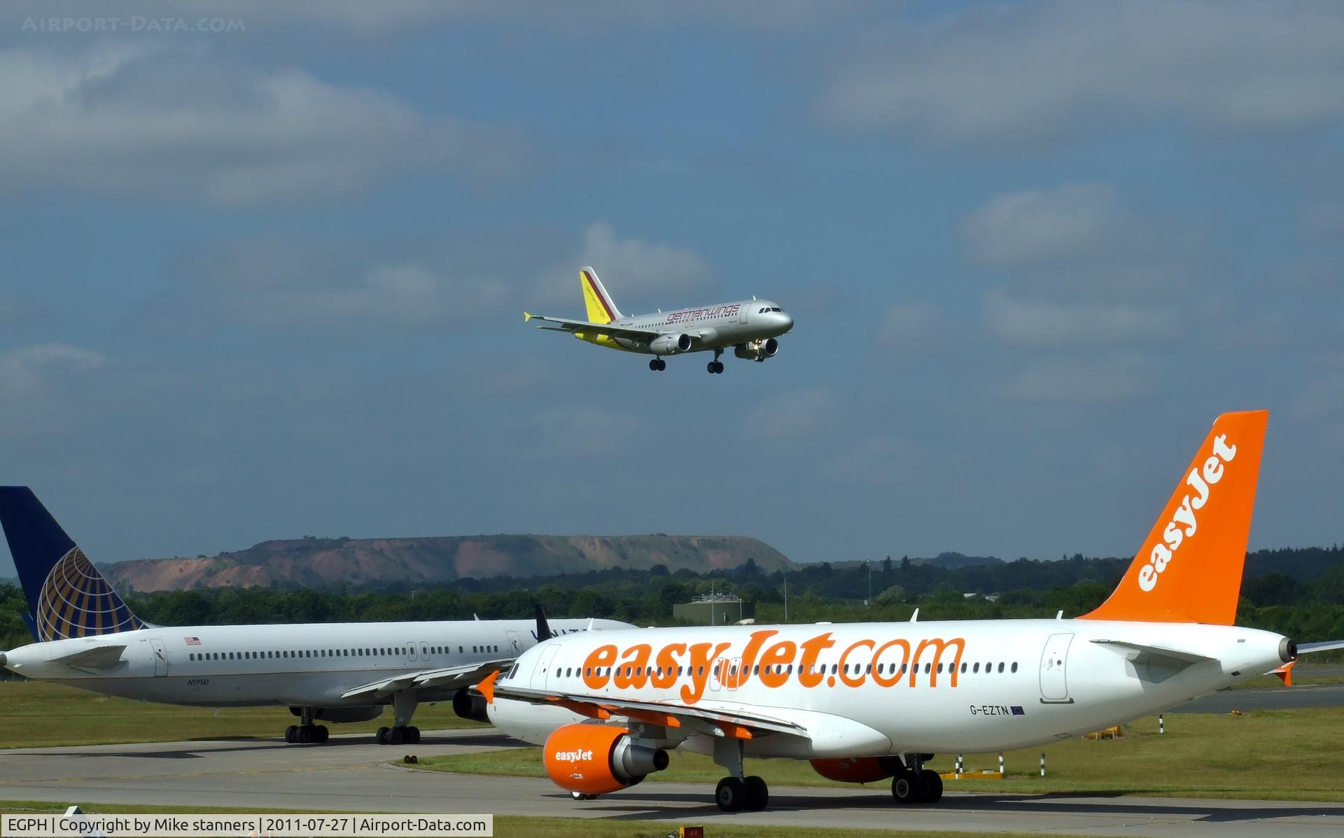 Edinburgh Airport, Edinburgh, Scotland United Kingdom (EGPH) - United B757-224 N19141 And Easyjet A320 G-EZTN Waiting for German wings A319 D-AGWM To land on runway 06