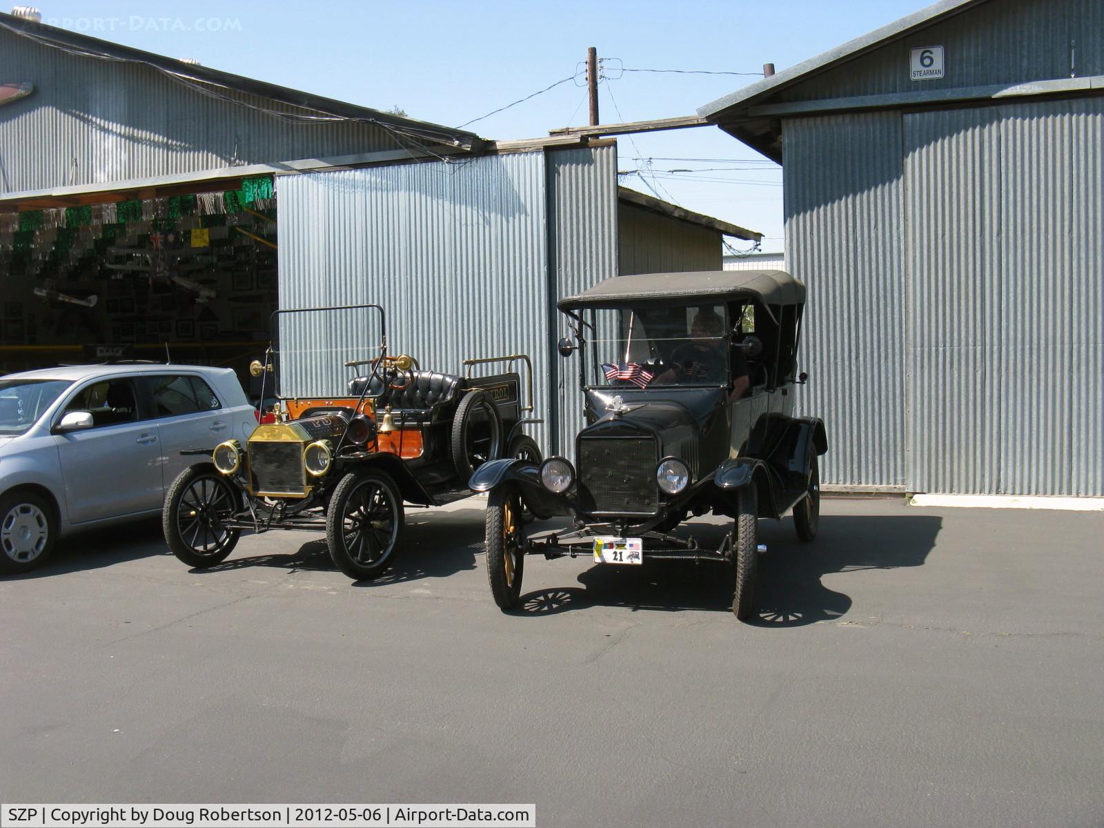Santa Paula Airport (SZP) - First Sunday Aviation Museum of Santa Paula Open House/Fly-In invites car clubs. These Model Ts are restored finer than Henry Ford originally built them, valued as the precious ore Unobtainium.