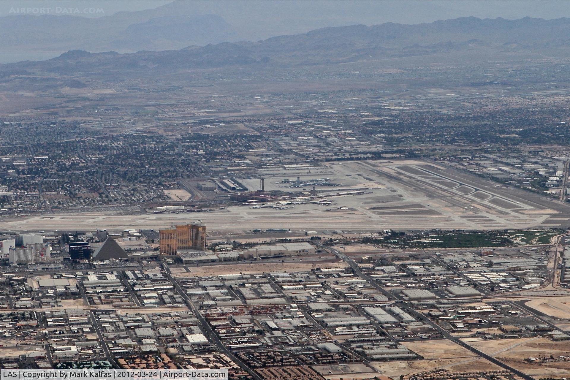 Harry Reid International Airport (LAS) - McCarran International/LAS, west of the airport, climbing through 6,000' heading 020 on the STAAV4 departure.