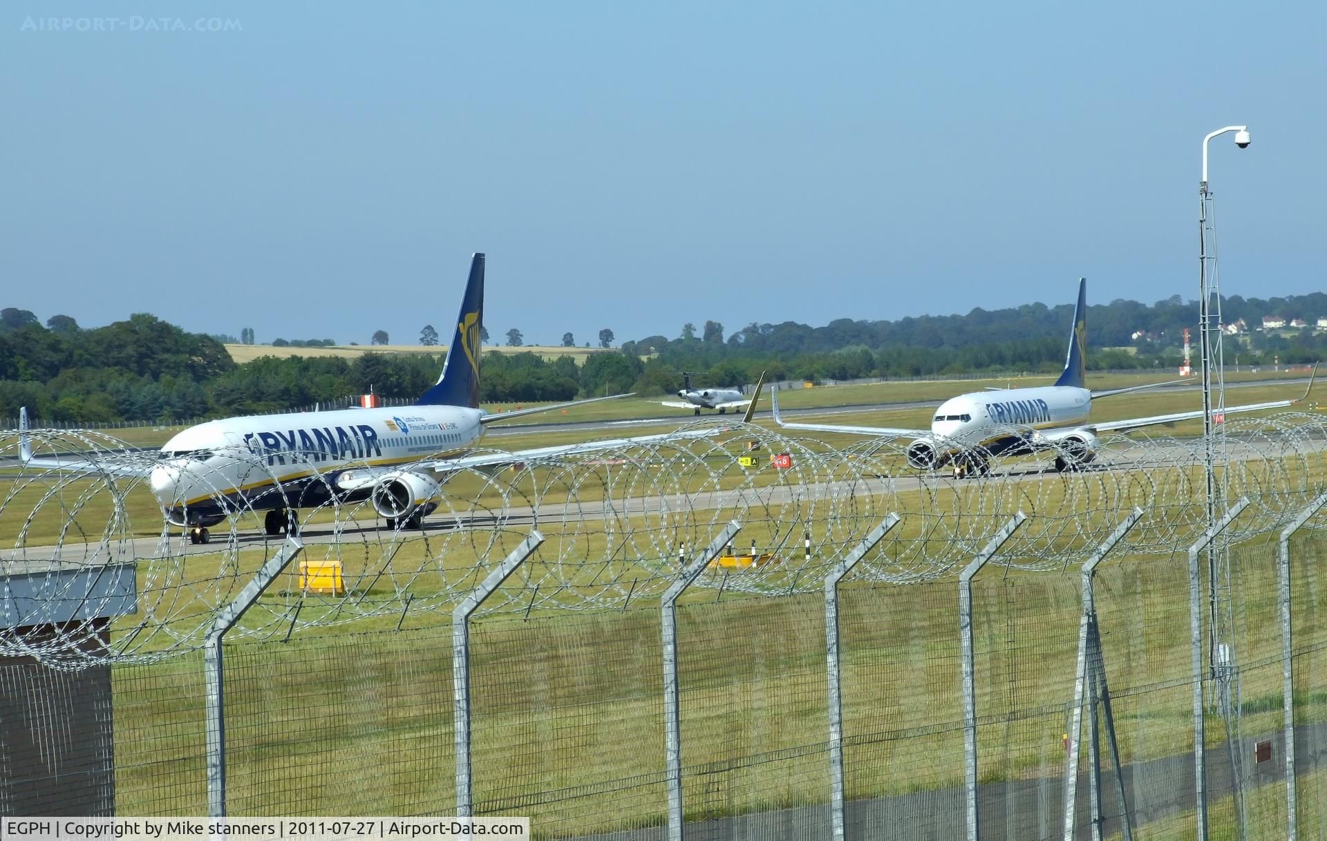 Edinburgh Airport, Edinburgh, Scotland United Kingdom (EGPH) - Ryanair B737-800's EI-DWC & EI-DAO Taxiing to runway 06,while in the back ground is G-RJXI 