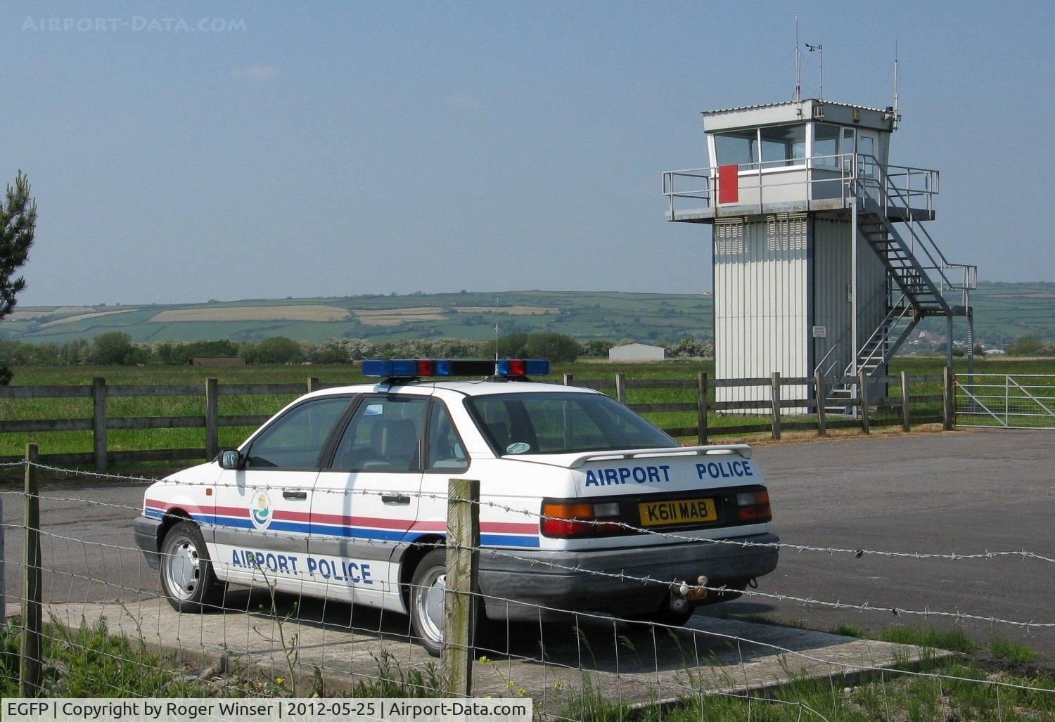 Pembrey Airport, Pembrey, Wales United Kingdom (EGFP) - Control Tower and airport security vehicle.