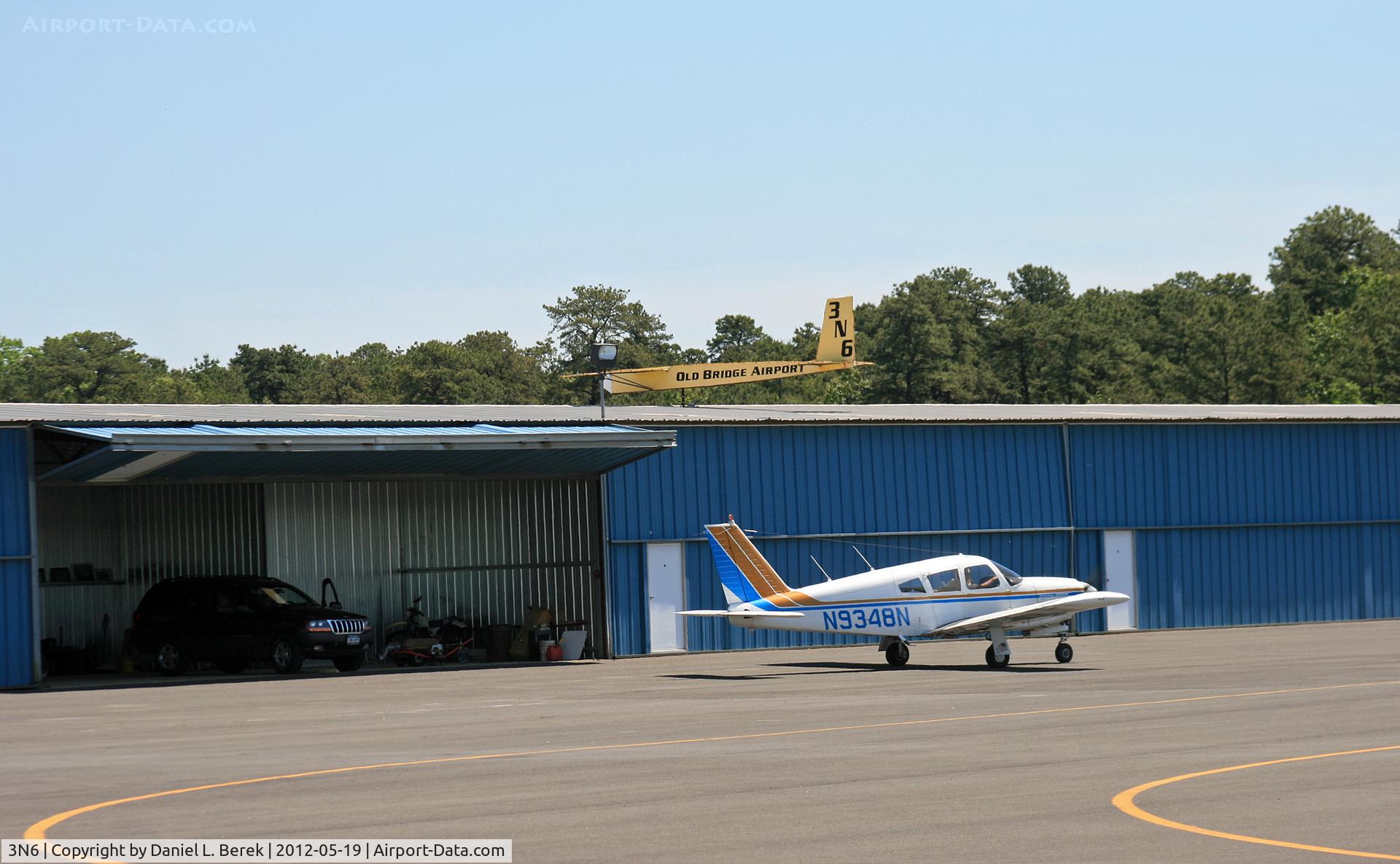 Old Bridge Airport (3N6) - This is the southern end of the airport, with the main taxiway in the background.  Gotta love that weathervane!