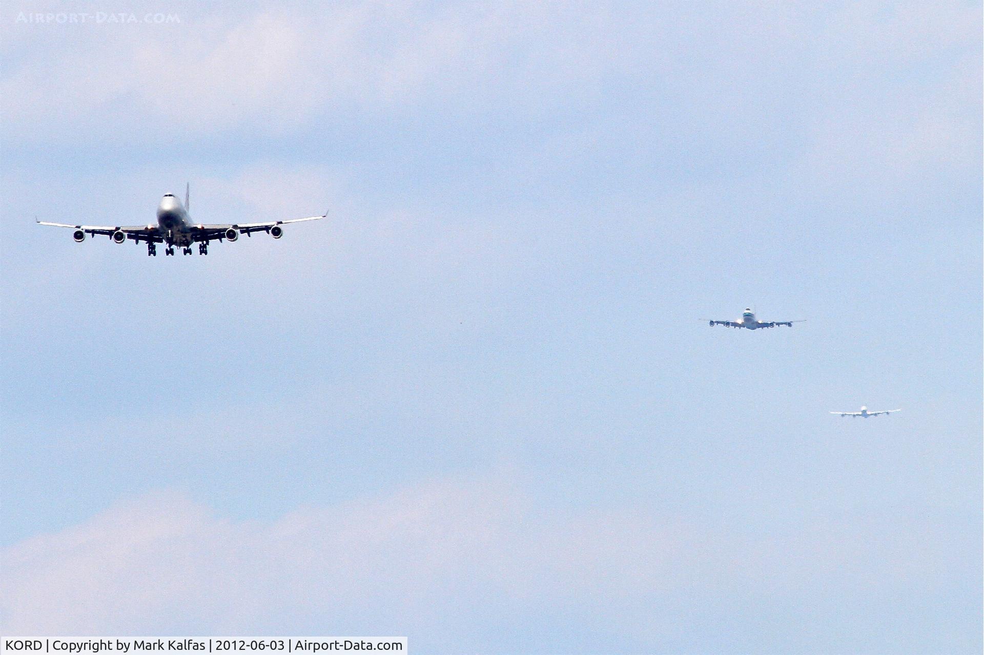 Chicago O'hare International Airport (ORD) - It is always a beautiful thing to see 3 jumbos lined up, in 60 second intervals for one runway at O'Hare.