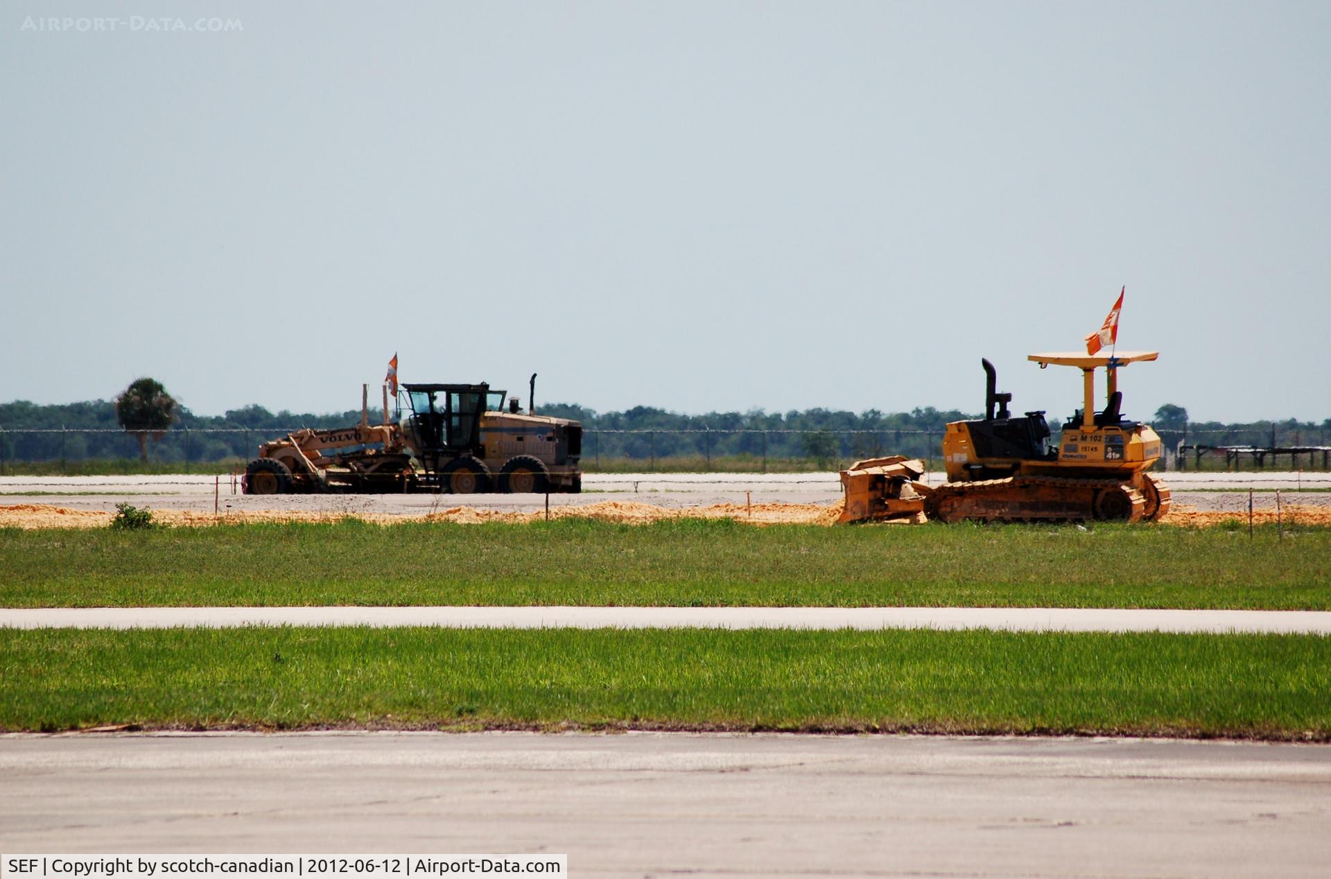 Sebring Regional Airport (SEF) - Volvo Road Grader and Komatsu D 41P Track Dozer work on Runway 18/36 at Sebring Regional Airport, Sebring, FL 