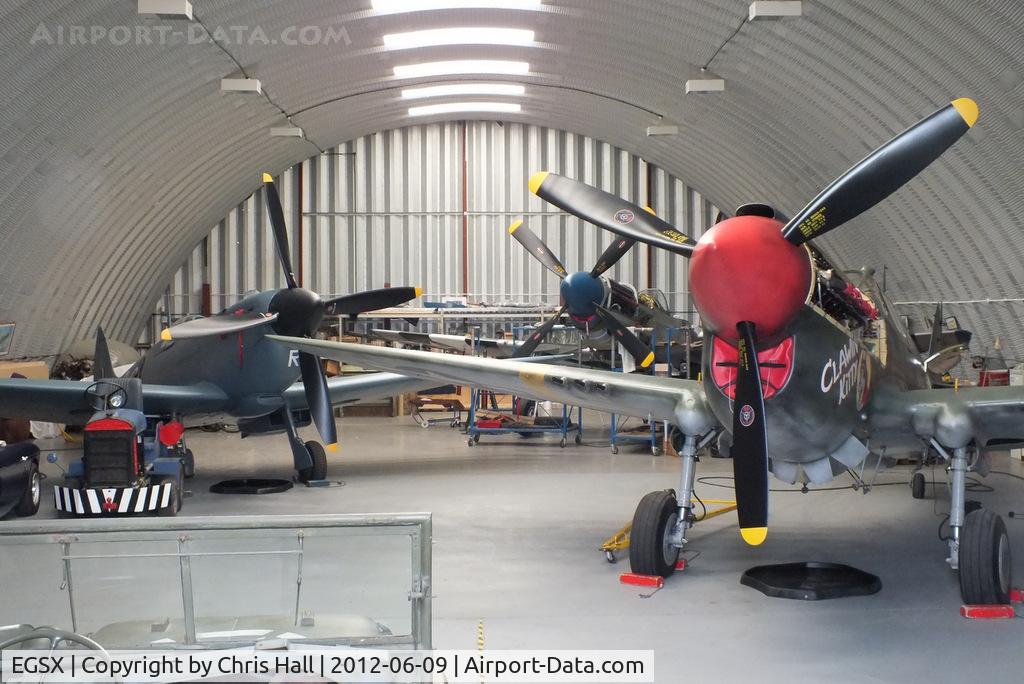 North Weald Airfield Airport, North Weald, England United Kingdom (EGSX) - from left to right, Supermarine Spitfire PR Mk XI PL965 (G-MKXI), North American P-51D Mustang 44-72035 (G-SIJJ) and Curtiss P-40 Kittyhawk 43-5802 (G-KITT) of the Hangar 11 collection