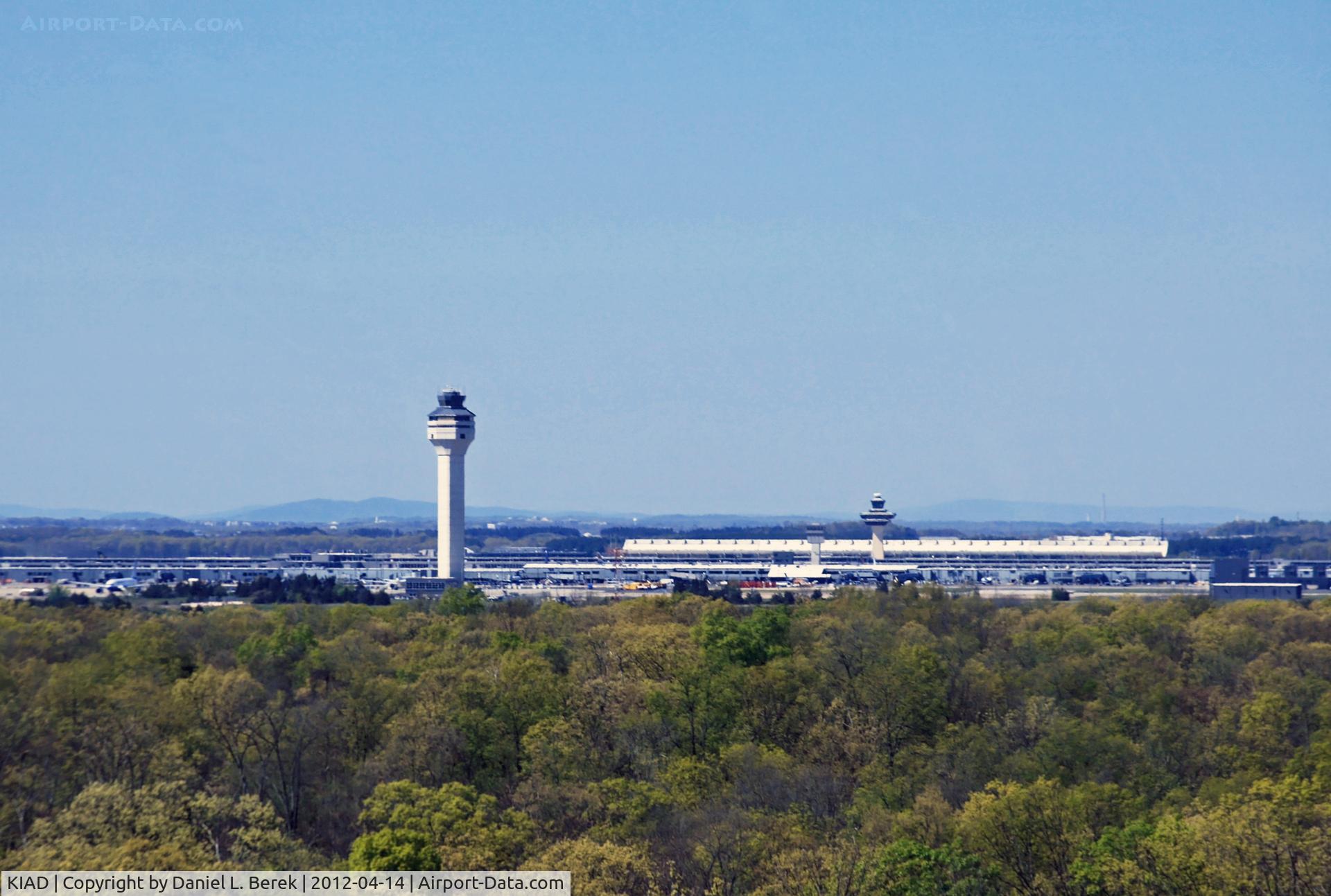 Washington Dulles International Airport (IAD) - The famous terminal by Eero Saarinen can be seen adjacent to the new control tower.
