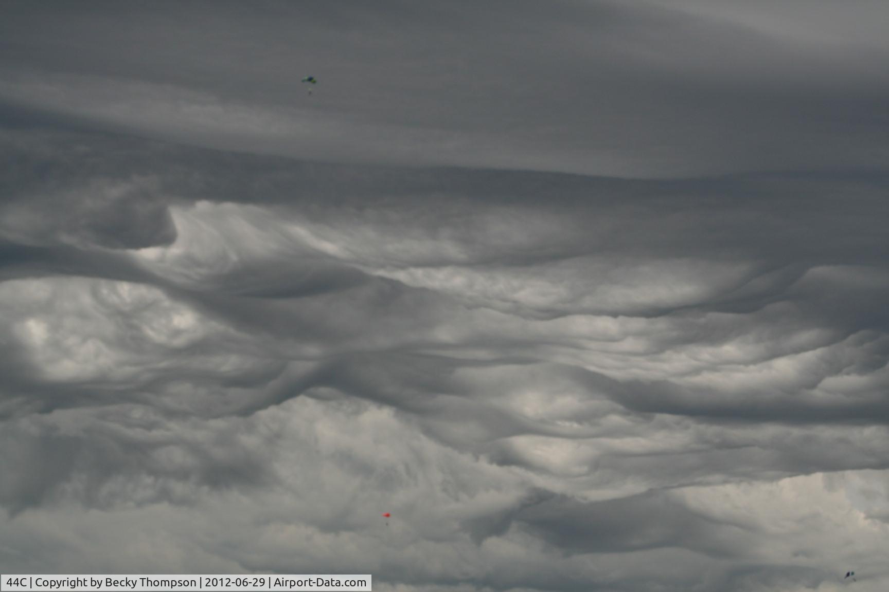 Beloit Airport (44C) - Pic#2 during parachute drop with unusual clouds in background!