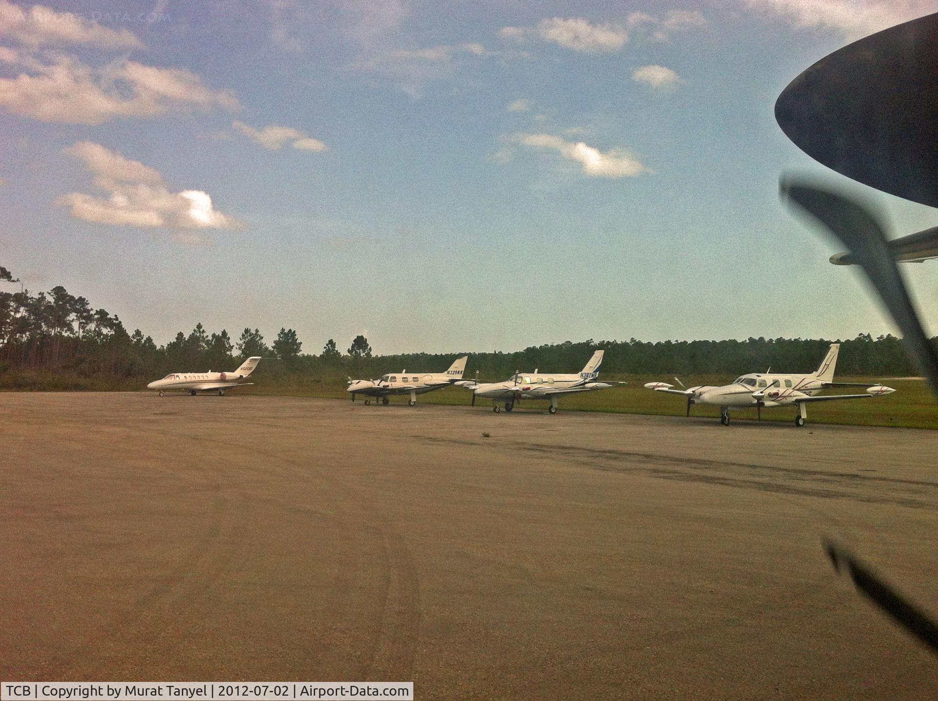Treasure Cay Airport, Treasure Cay, Abaco Bahamas (TCB) - Parked planes as we taxi to the gate at TCB