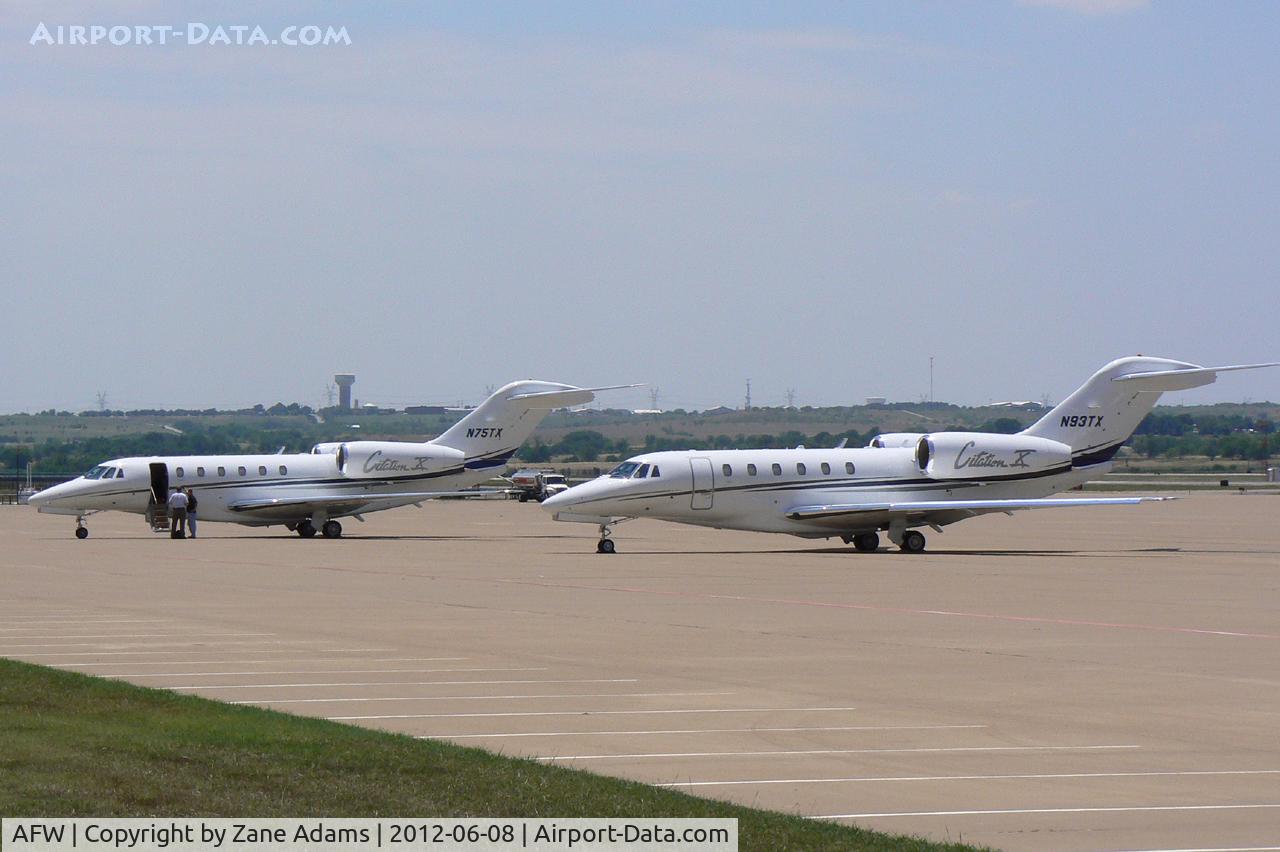 Fort Worth Alliance Airport (AFW) - Both of Textron's jets on the ramp in front of the Bell Helicopter Hanger
