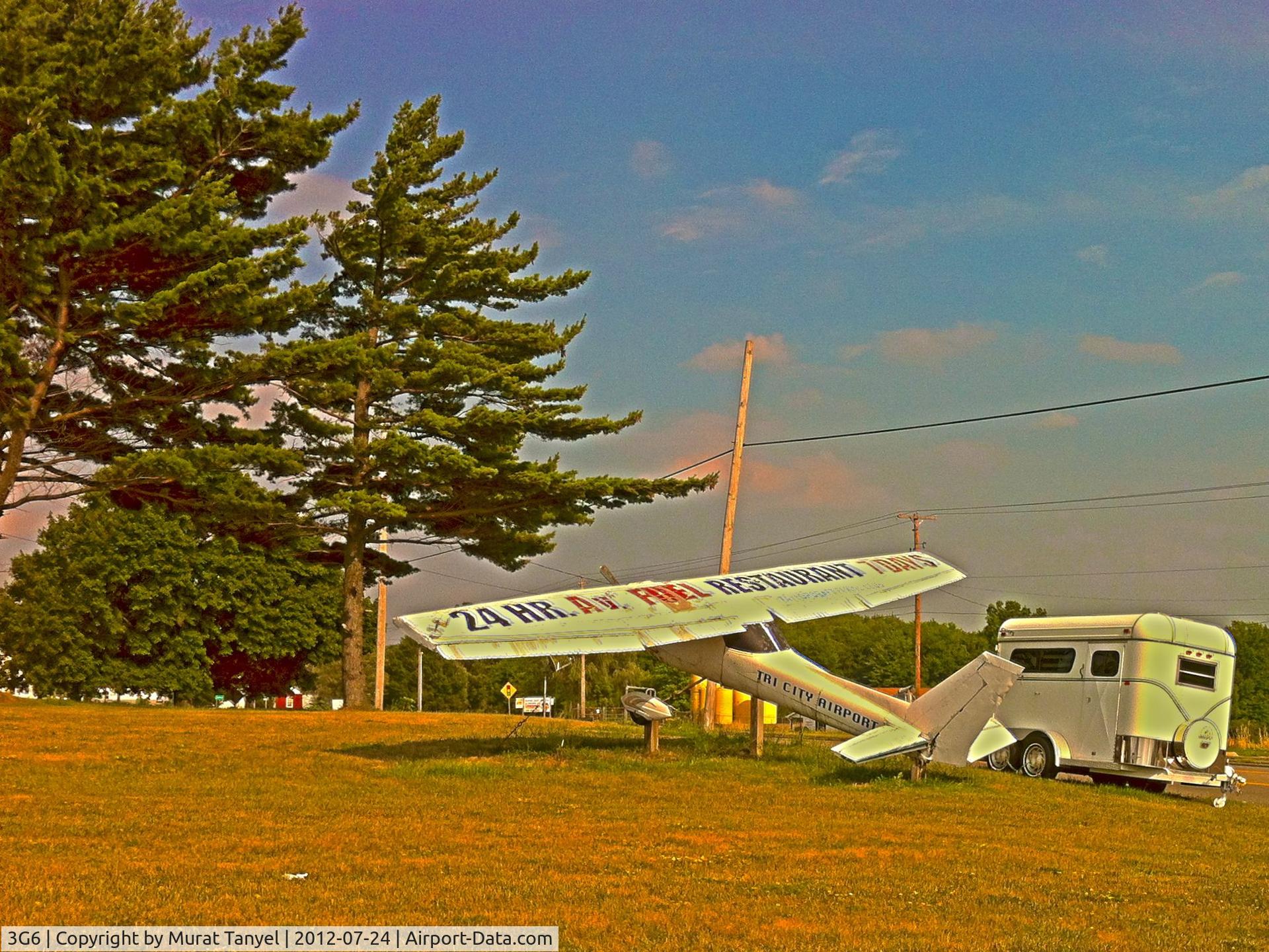 Tri-city Airport (3G6) - Entrance to the airport, advertising 24-hr fuel and 7-day restaurant