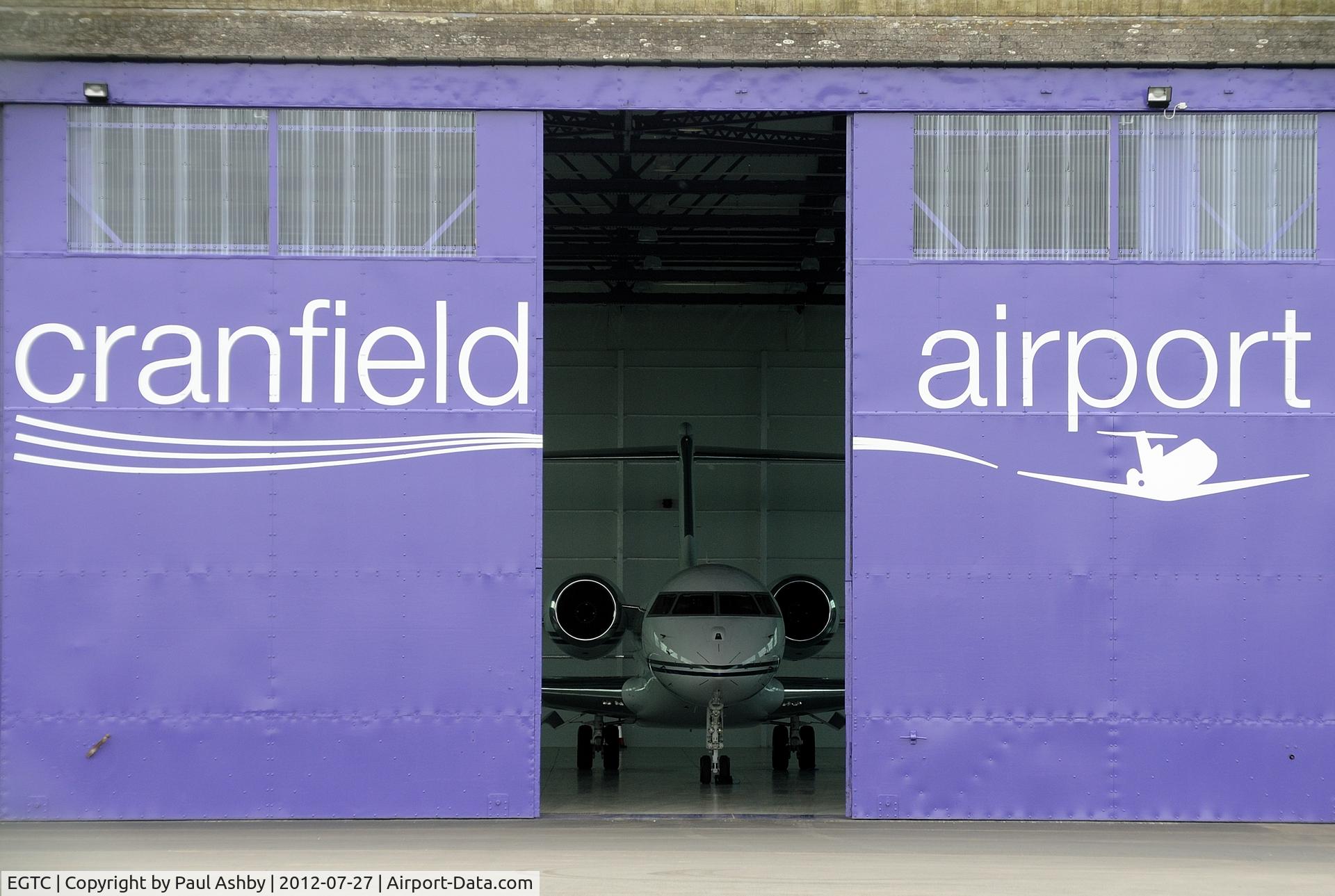 Cranfield Airport, Cranfield, England United Kingdom (EGTC) - New paintwork on a hangar at Cranfield Airport