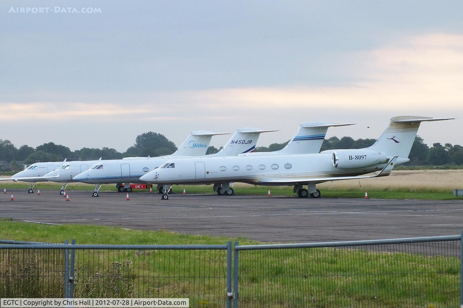 Cranfield Airport, Cranfield, England United Kingdom (EGTC) - bizjets parked at Cranfield with visitors for the opening of the London 2012 Olympic games. From L to R are B-8098, N450JR, N780W and B-8097