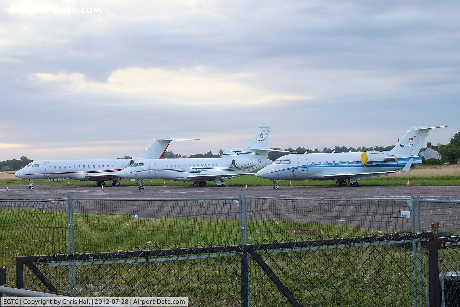 Cranfield Airport, Cranfield, England United Kingdom (EGTC) - bizjets parked at Cranfield with visitors for the opening of the London 2012 Olympic games. From L to R are N1812C, N747RL and HB-JRQ