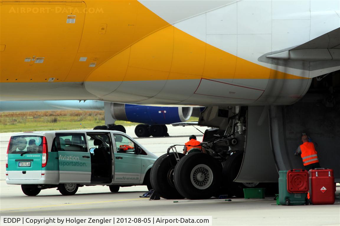 Leipzig/Halle Airport, Leipzig/Halle Germany (EDDP) - Have you ever done with your cars wheel house what this guy do on a triple seven?