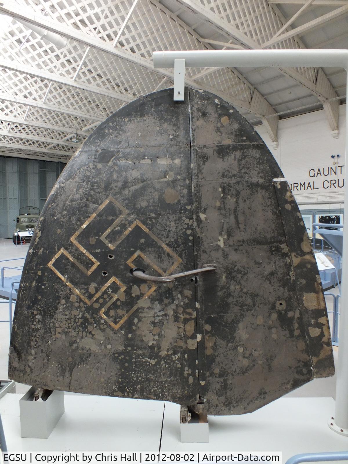 Duxford Airport, Cambridge, England United Kingdom (EGSU) - Heinkel HE 111E tail fin recovered from Storvatnet Lake, Norway in 1974. Displayed at the IWM Duxford