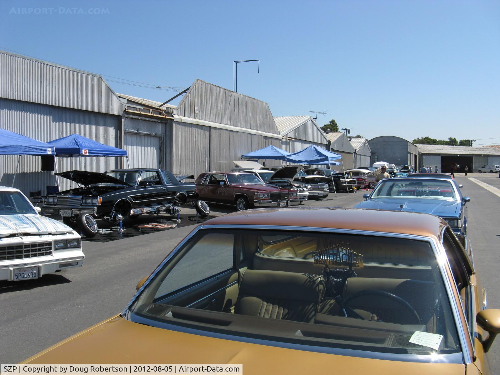 Santa Paula Airport (SZP) - First Sunday Aviation Museum of Santa Paula Open House & Fly-In invites car clubs-another hydraulically jacked up custom car showing suspension, hydraulics and custom wheels. 