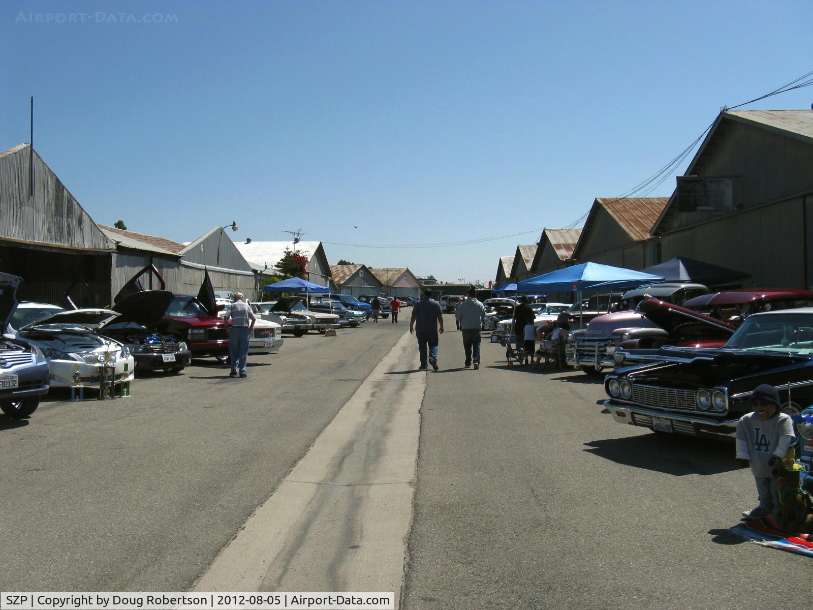 Santa Paula Airport (SZP) - First Sunday Aviation Museum of Santa Paula Open House & Fly-In invites car clubs-this is largest gathering I've seen in many years with vendors, a free band and the cars.