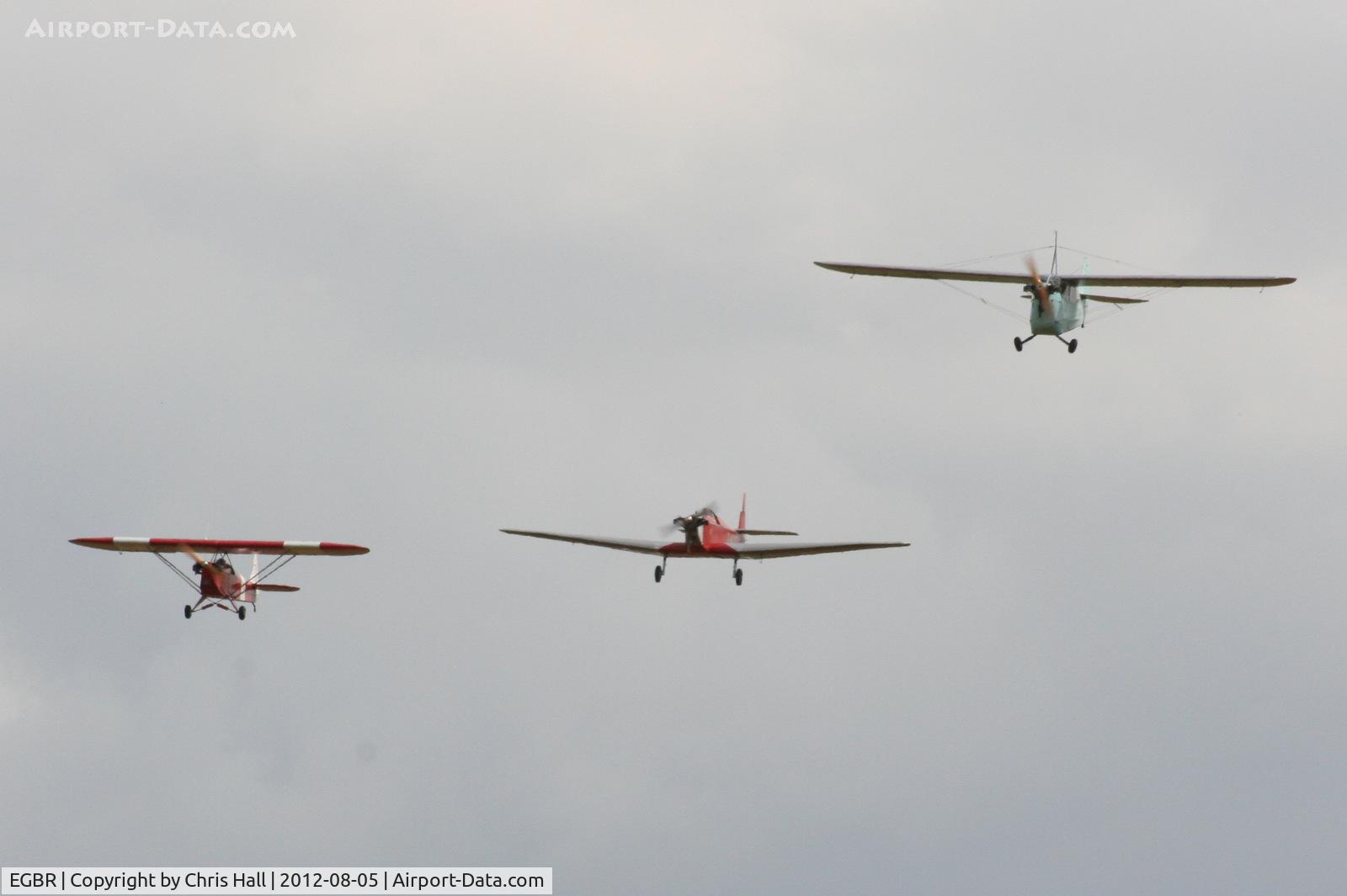 EGBR Airport - from L to R, Luton LA4A Minor G-ATCN, Dart Kitten II G-AEXT and Aeronca 100 G-AEVS at the Real Aeroplane Club's Summer Madness Fly-In, Breighton