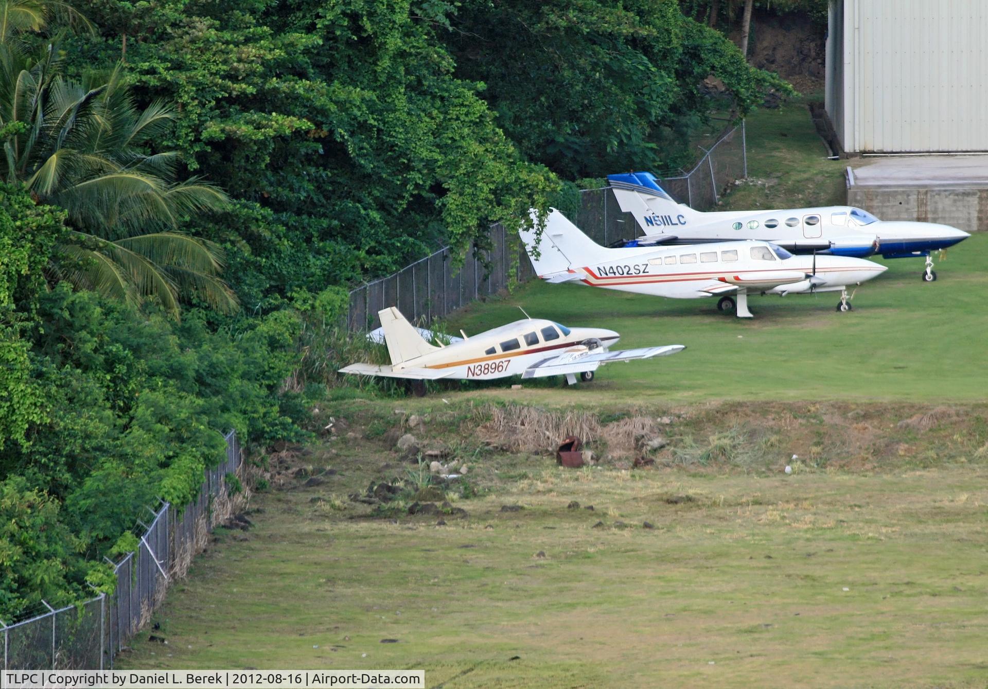 George F. L. Charles Airport (formerly Vigie Airport), Castries, Saint Lucia Saint Lucia (TLPC) - Three abandoned aircraft are parked at a remote stand at George F. L. Charles Airport, Castries, St. Lucia; the one in the foreground once belonging to Bird of Paradise, the other two to General Aviation Services.