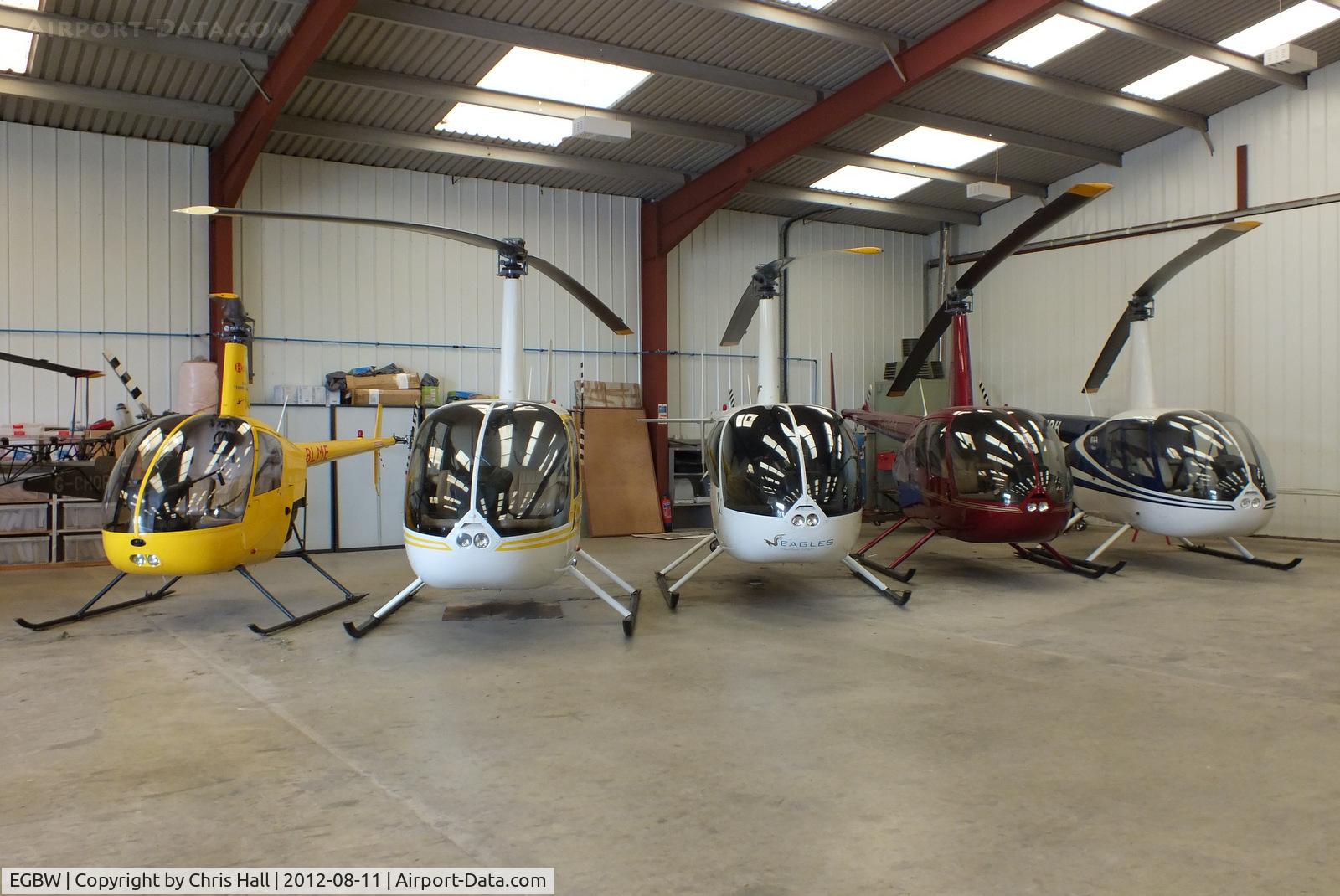 Wellesbourne Mountford Airfield Airport, Wellesbourne, England United Kingdom (EGBW) - from L to R, G-BLME, G-MISK, G-MENU, G-JTSA and G-OJRH inside the Heli Air hangar