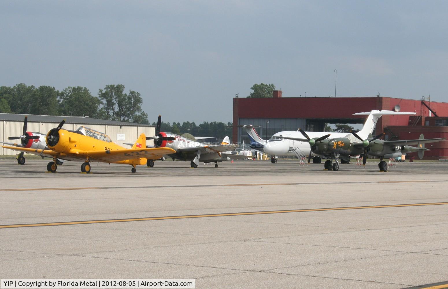 Willow Run Airport (YIP) - ramp overview P-38, T-6, 2 P-47s and a couple DC-9s at Thunder Over Michigan