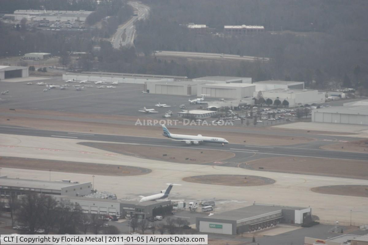 Charlotte/douglas International Airport (CLT) - Further down, as we still can see the ATI DC-8 coming to a stop on the runway.  One of Jack Roush (NASCAR owner) former 727-100s sitting without engines on the ramp