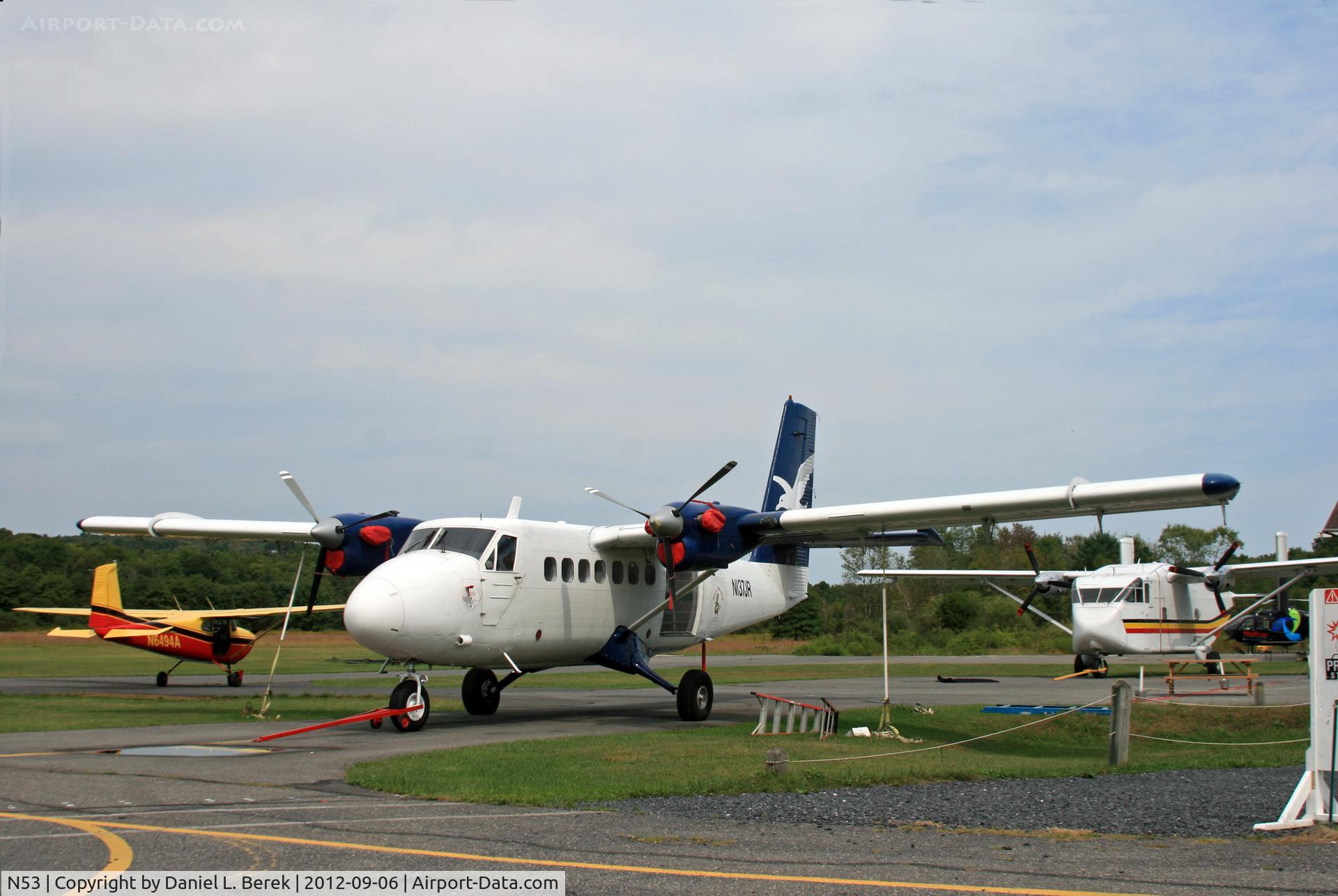 Stroudsburg-pocono Airport (N53) - A Twin Otter, Short Skyvan, and Cessna Skylane share the J R S Sky ramp at Stroudsburg-Pocono Airport; the turboprops are used for skydiving.