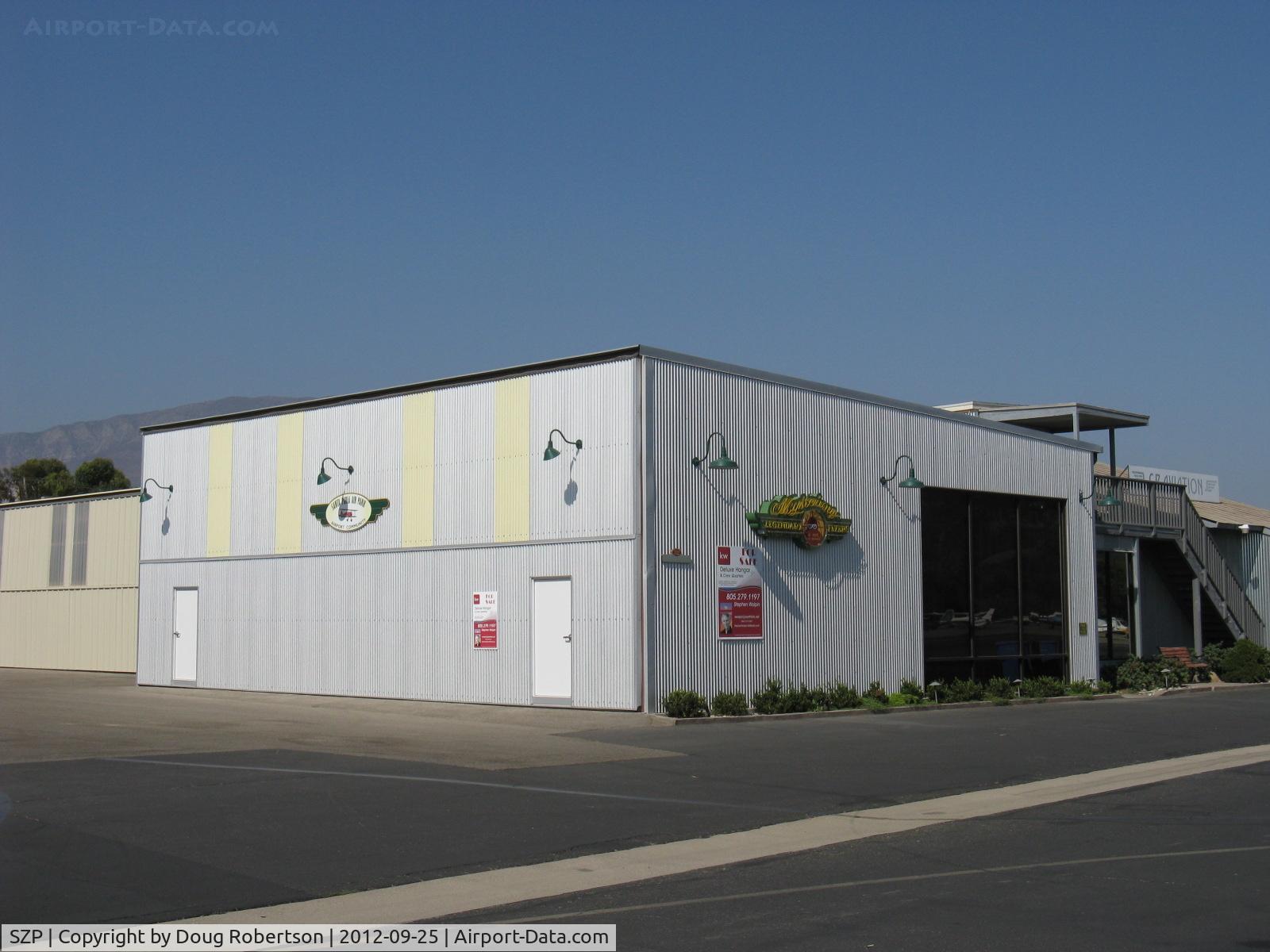 Santa Paula Airport (SZP) - Large deluxe hangar FOR SALE. New broker listing. Prime location. Bi-fold electric door, kitchen. lounge, picture window and bath.
