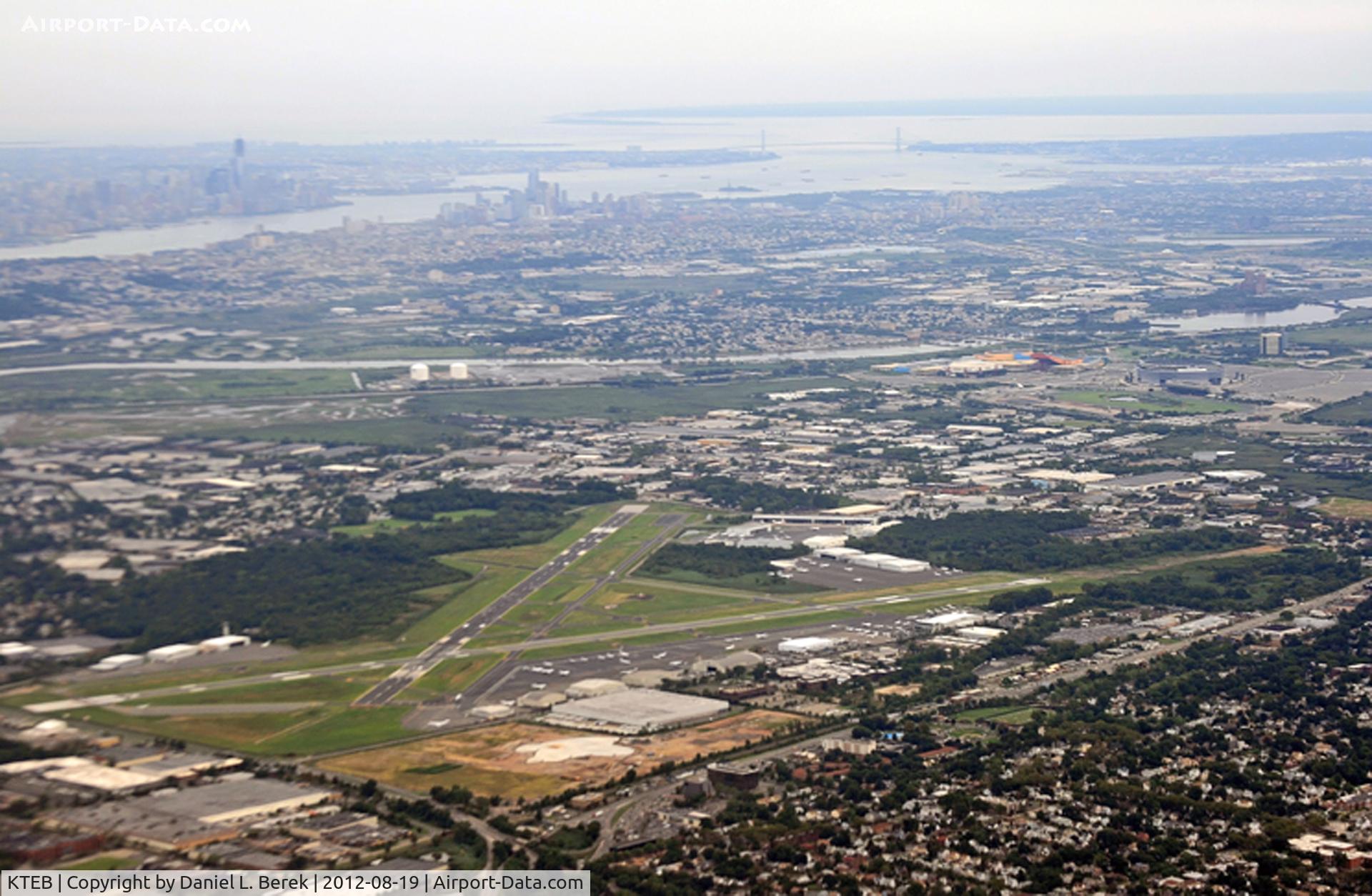 Teterboro Airport (TEB) - With Teterboro Airport in the foreground (seen from the northern end, with the old tower and the Aviation Hall of Fame of New Jersey to the left, we have a panoramic view of Newark, Manhattan, the Hudson, and the Brooklyn Bridge.