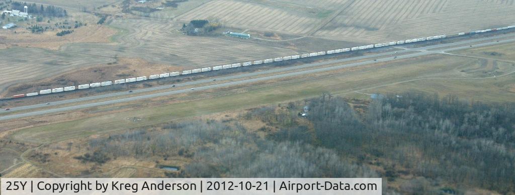 25Y Airport - View of the former New York Mills Municipal Airport (25Y) in New York Mills, MN. Runway runs parallel to US Highway 10, just north of the road. Photo is looking south.